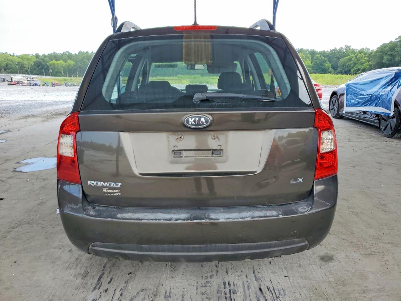 2009 Kia Rondo Base Brown vin: KNAFG528997264597