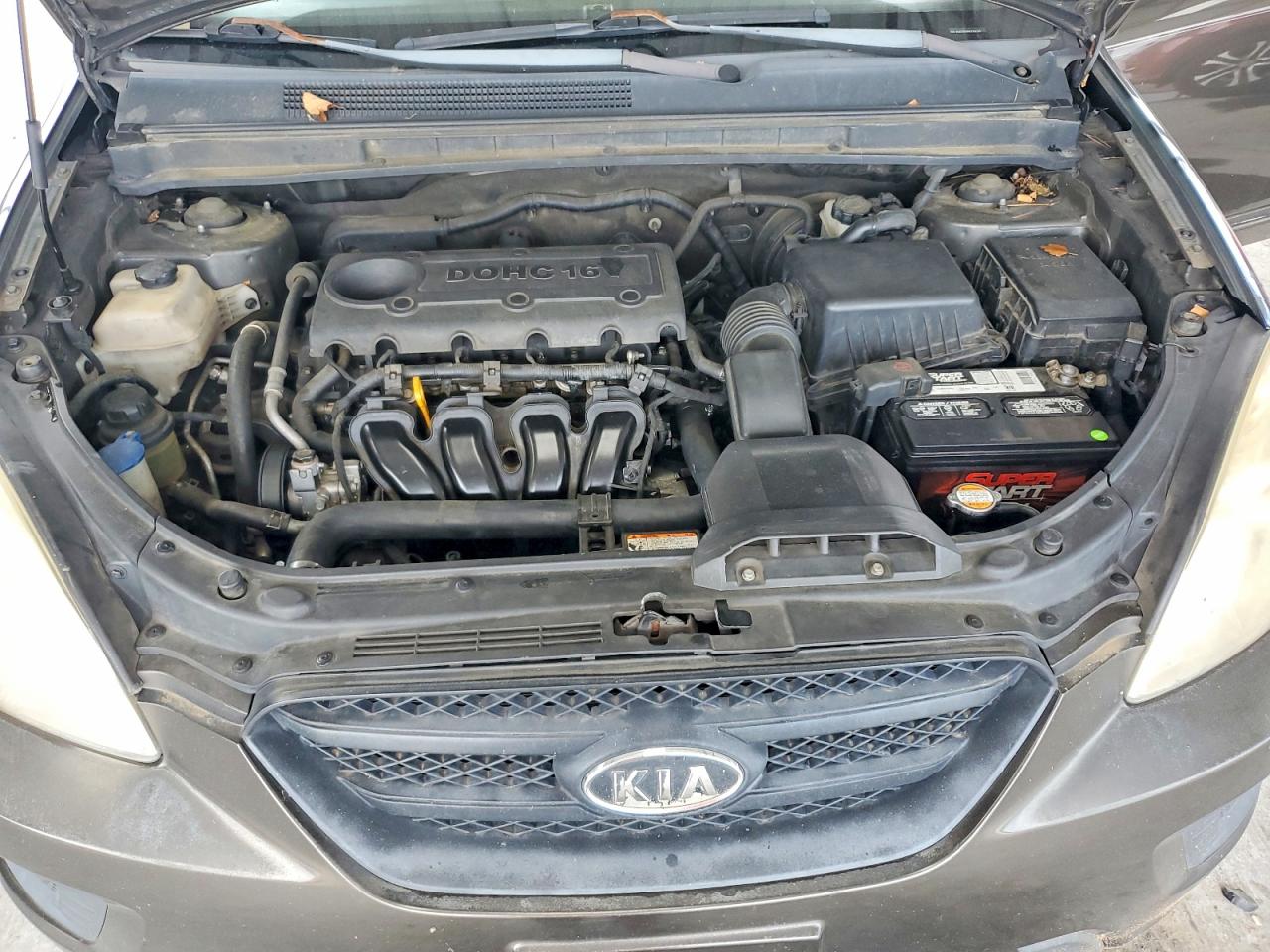 2009 Kia Rondo Base Brown vin: KNAFG528997264597