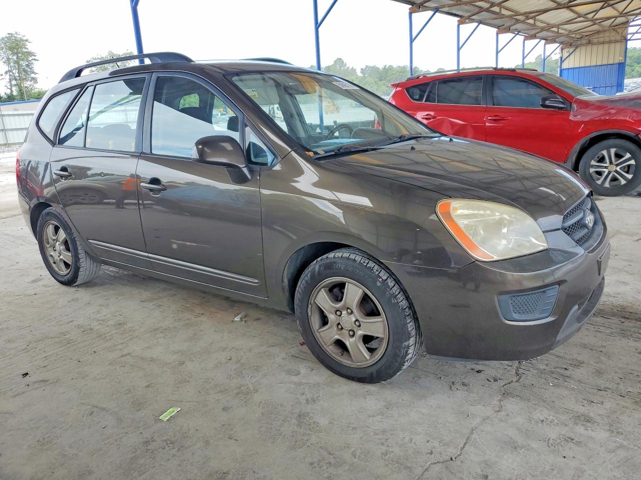 2009 Kia Rondo Base Brown vin: KNAFG528997264597