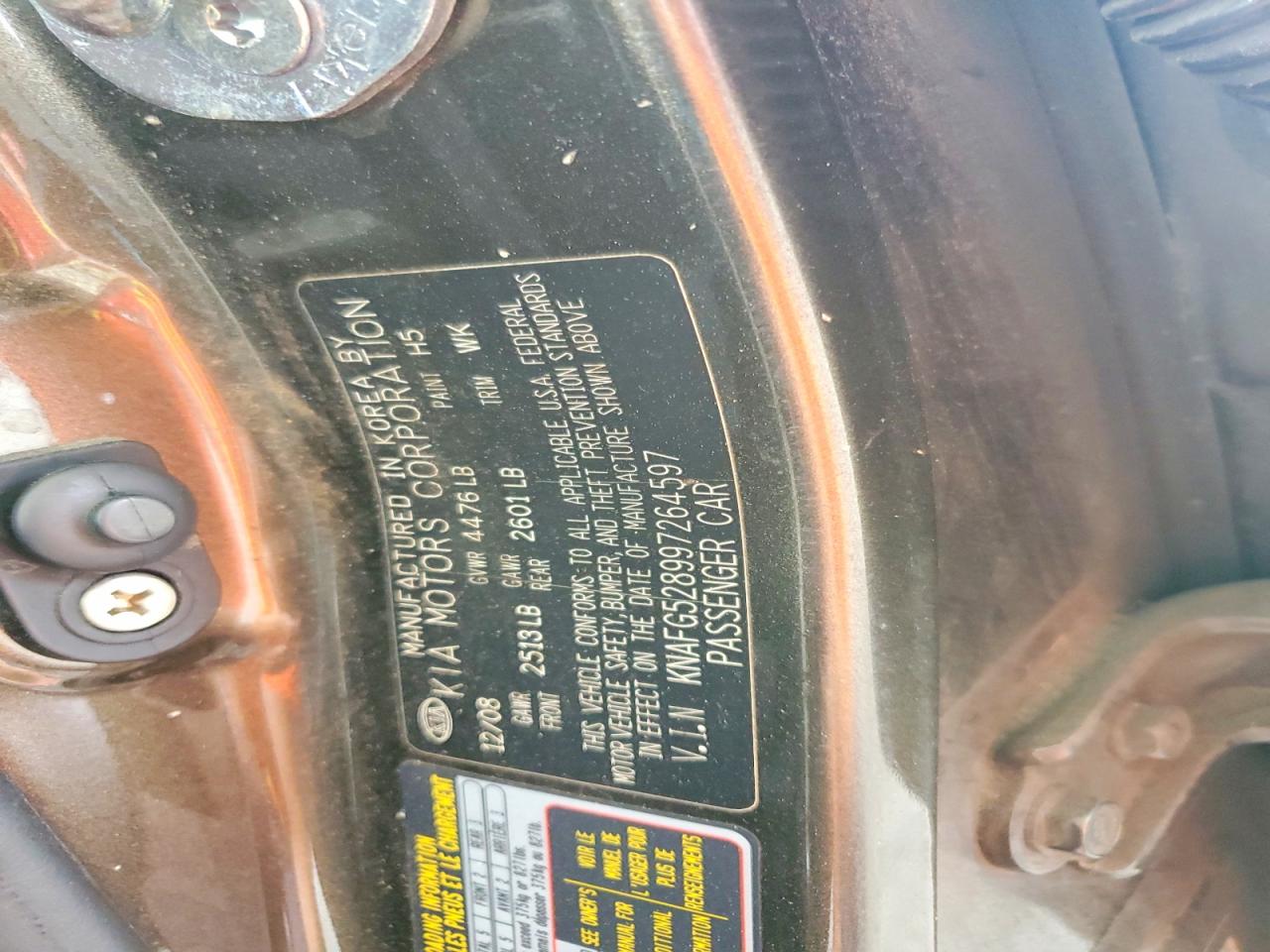 2009 Kia Rondo Base Brown vin: KNAFG528997264597