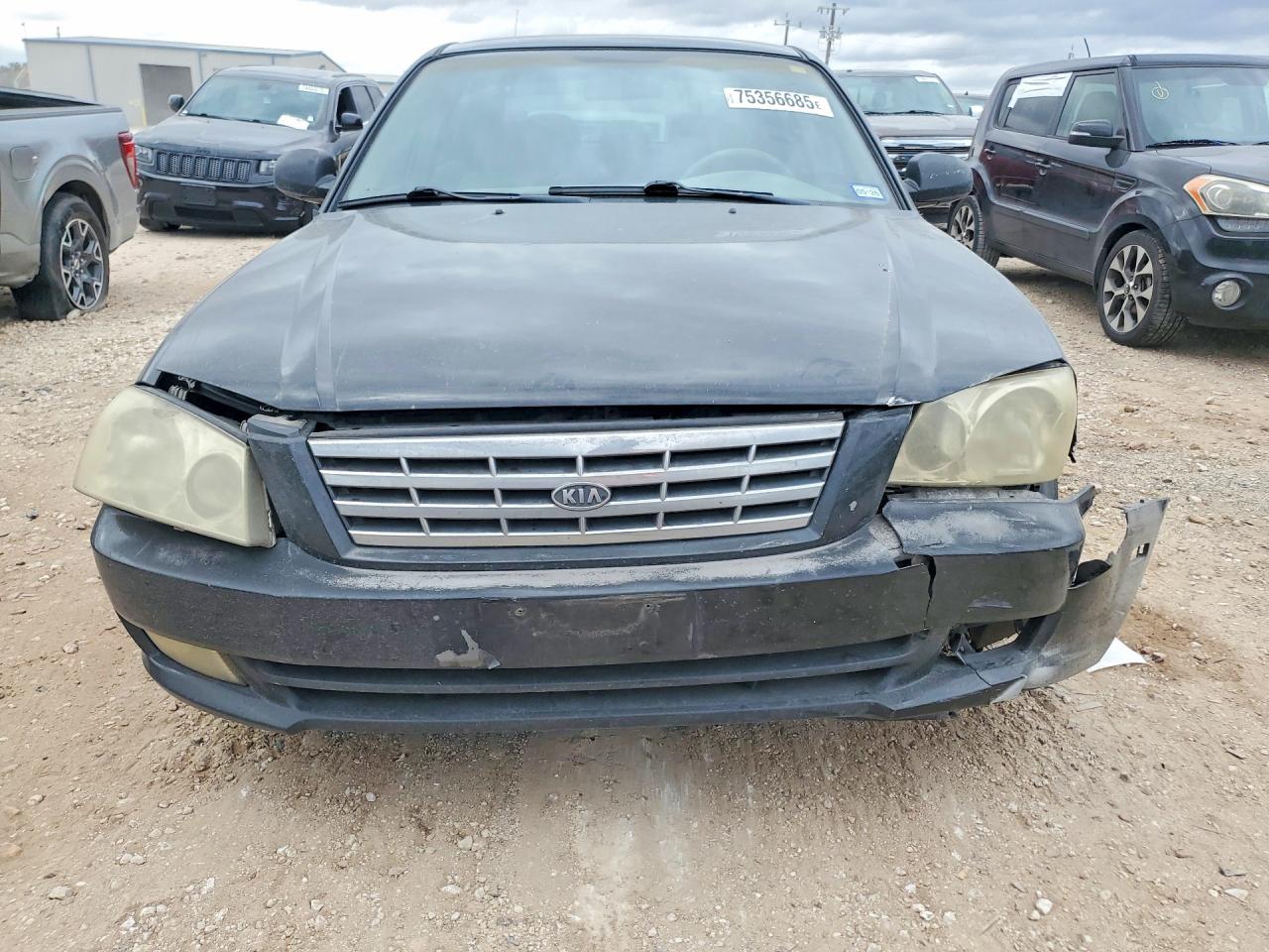 2002 Kia Optima Magentis Black vin: KNAGD128625123090