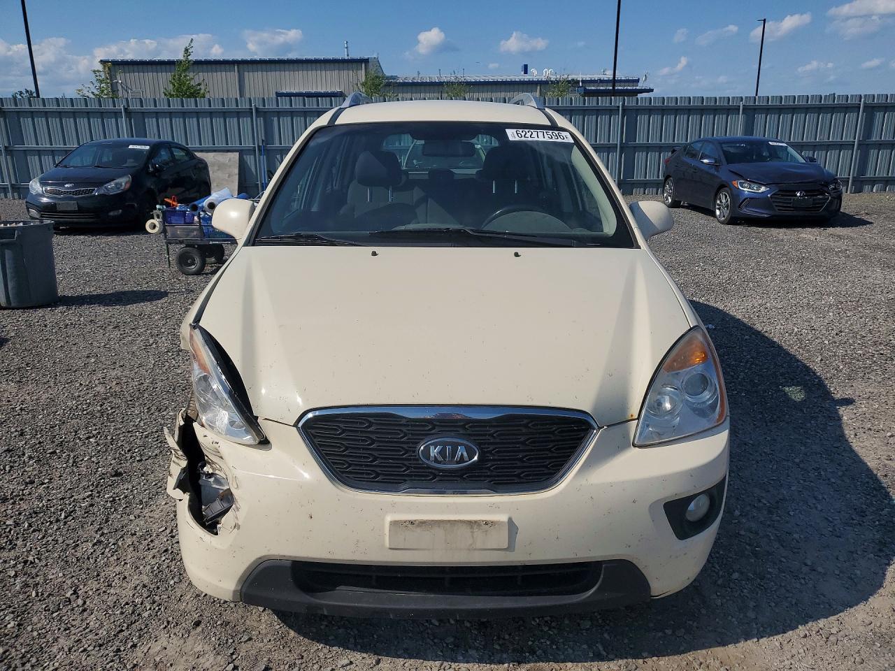 2012 Kia Rondo Cream vin: KNAHH8A65C7408564