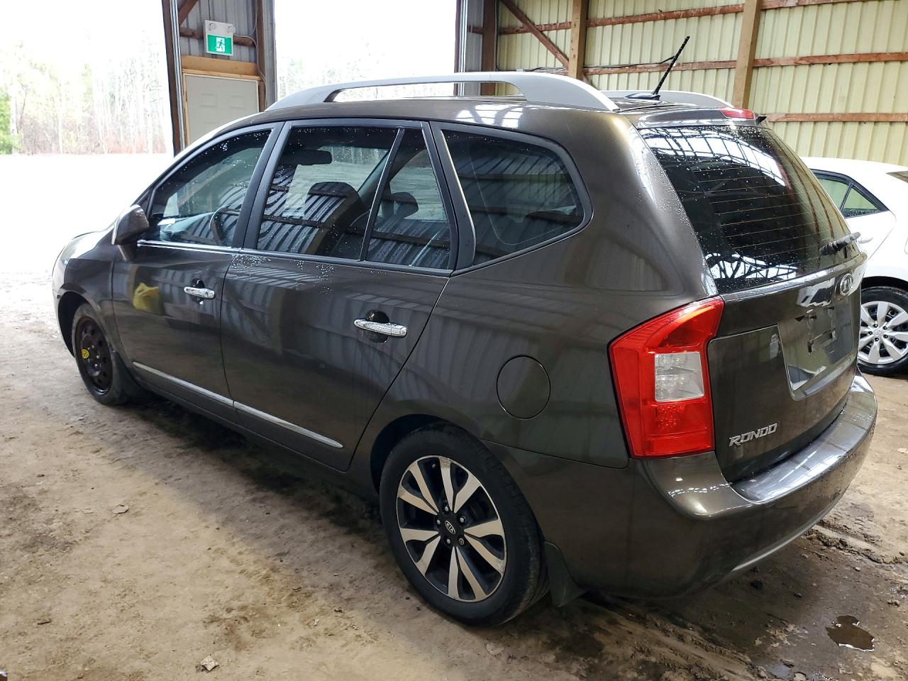 2011 Kia Rondo Коричневый vin: KNAHH8C61B7343854