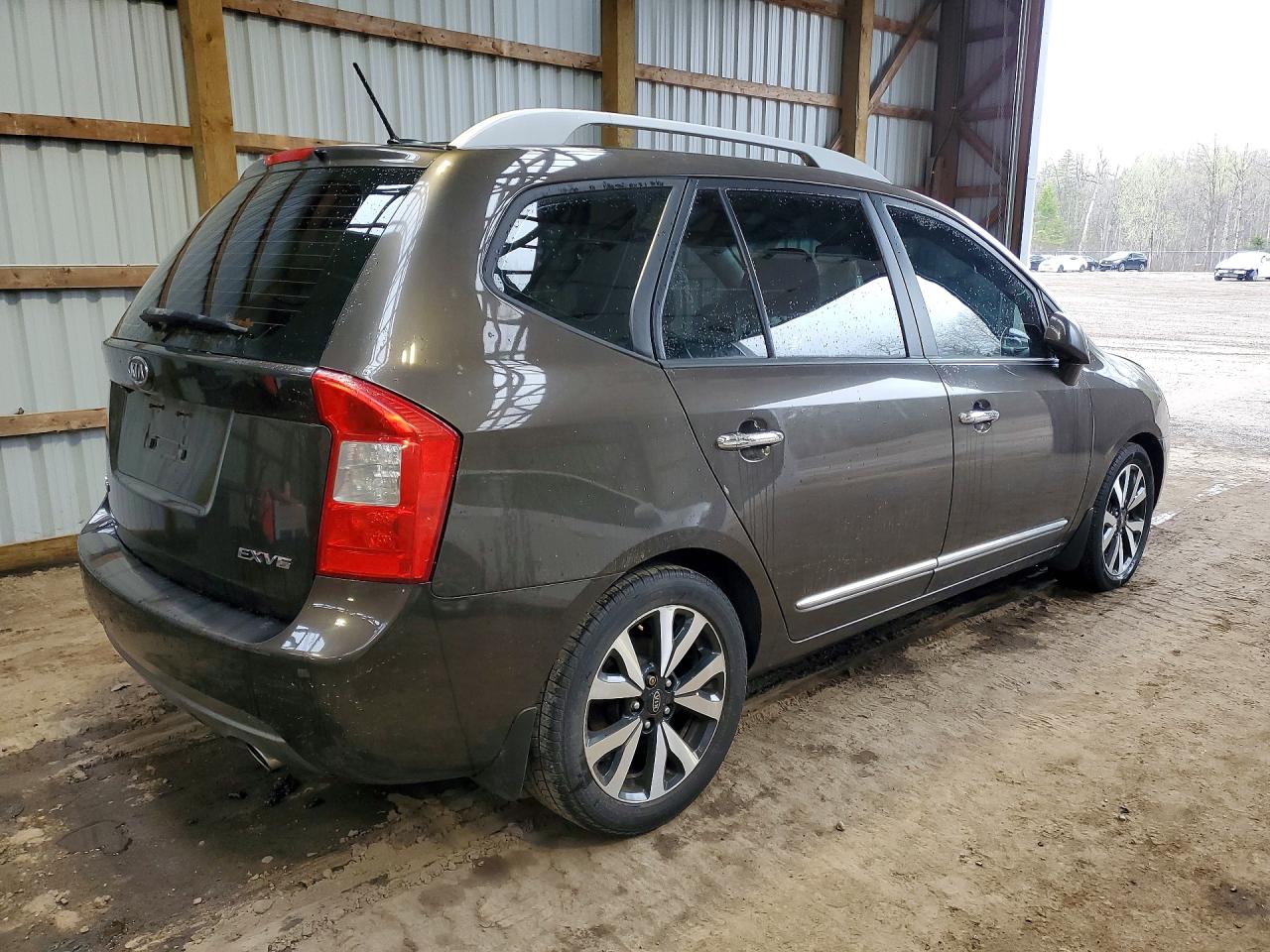 2011 Kia Rondo Коричневый vin: KNAHH8C61B7343854