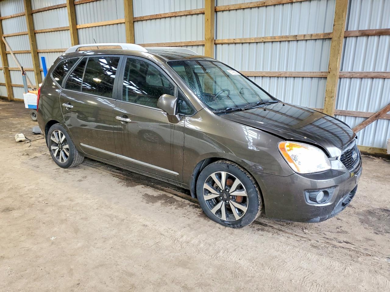 2011 Kia Rondo Коричневый vin: KNAHH8C61B7343854