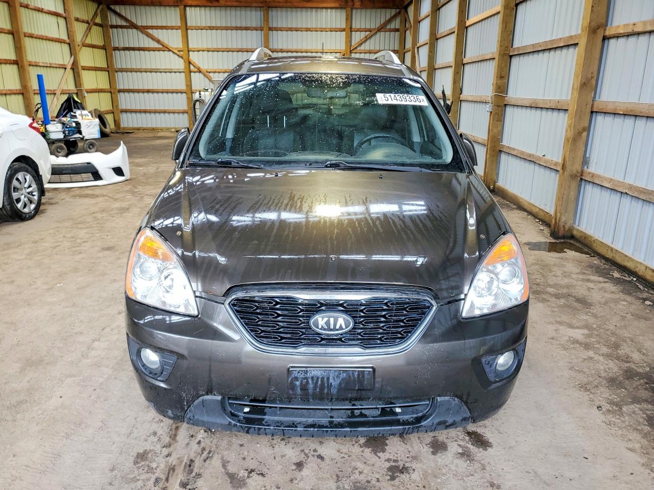 2011 Kia Rondo Коричневый vin: KNAHH8C61B7343854