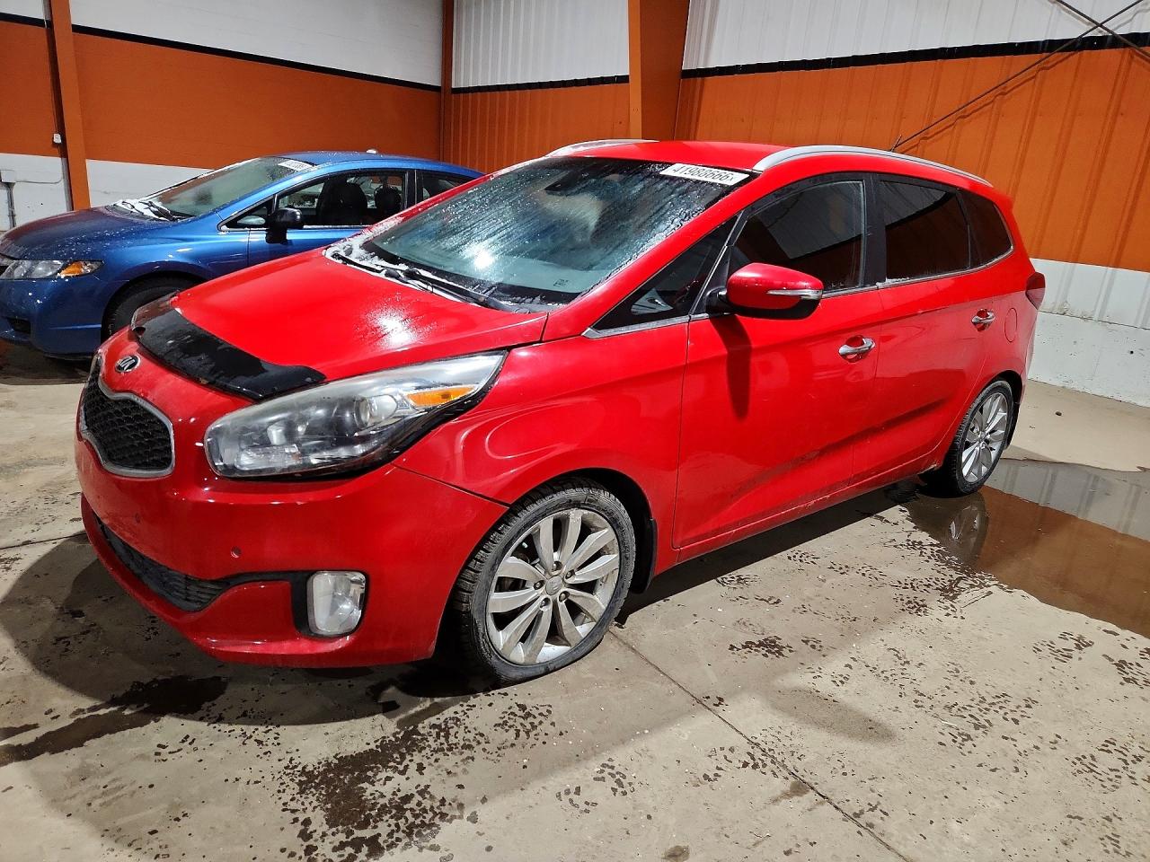 2015 Kia Rondo Red vin: KNAHU8A32F7077416