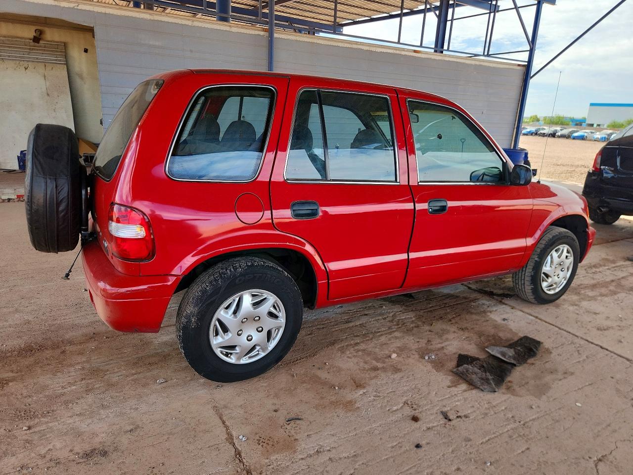 2001 Kia Sportage Base Red vin: KNDJB723415060186