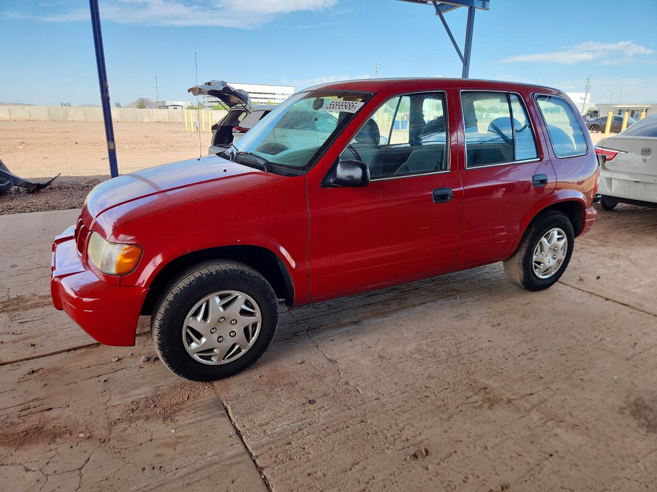 2001 Kia Sportage Base Red vin: KNDJB723415060186