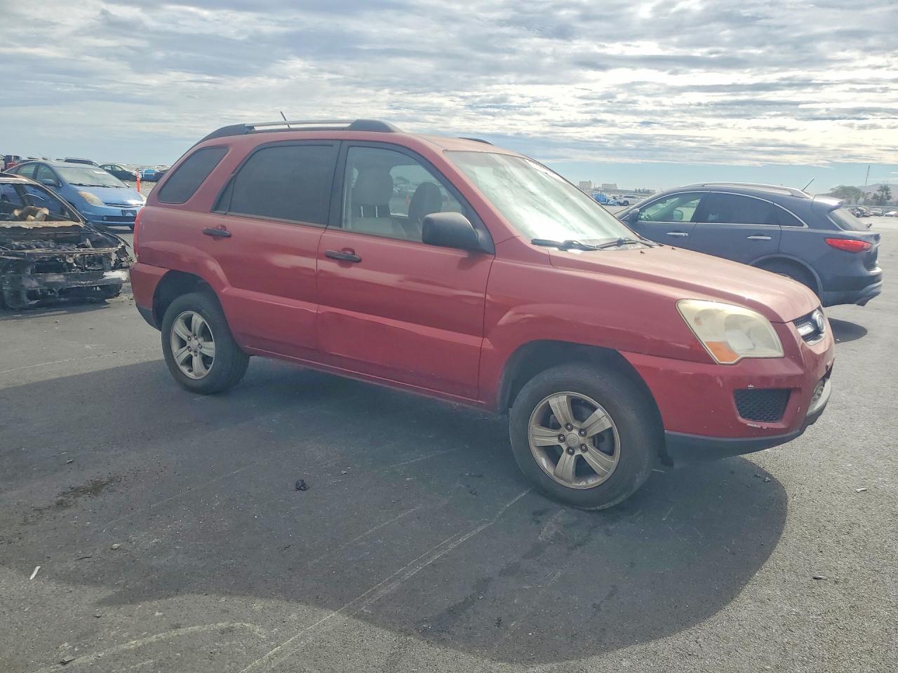 2009 Kia Sportage Lx Red vin: KNDJF724X97558048