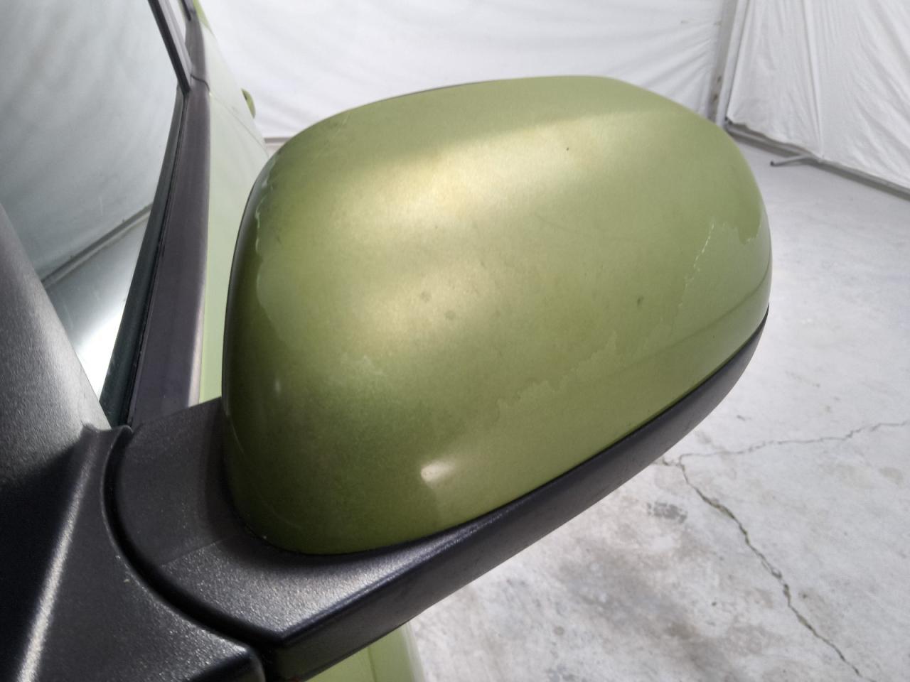 2015 Kia Soul Base Green vin: KNDJN2A22F7791410 Damage: Lf Mirror Cover, Peeling, 9 To 10 Inches