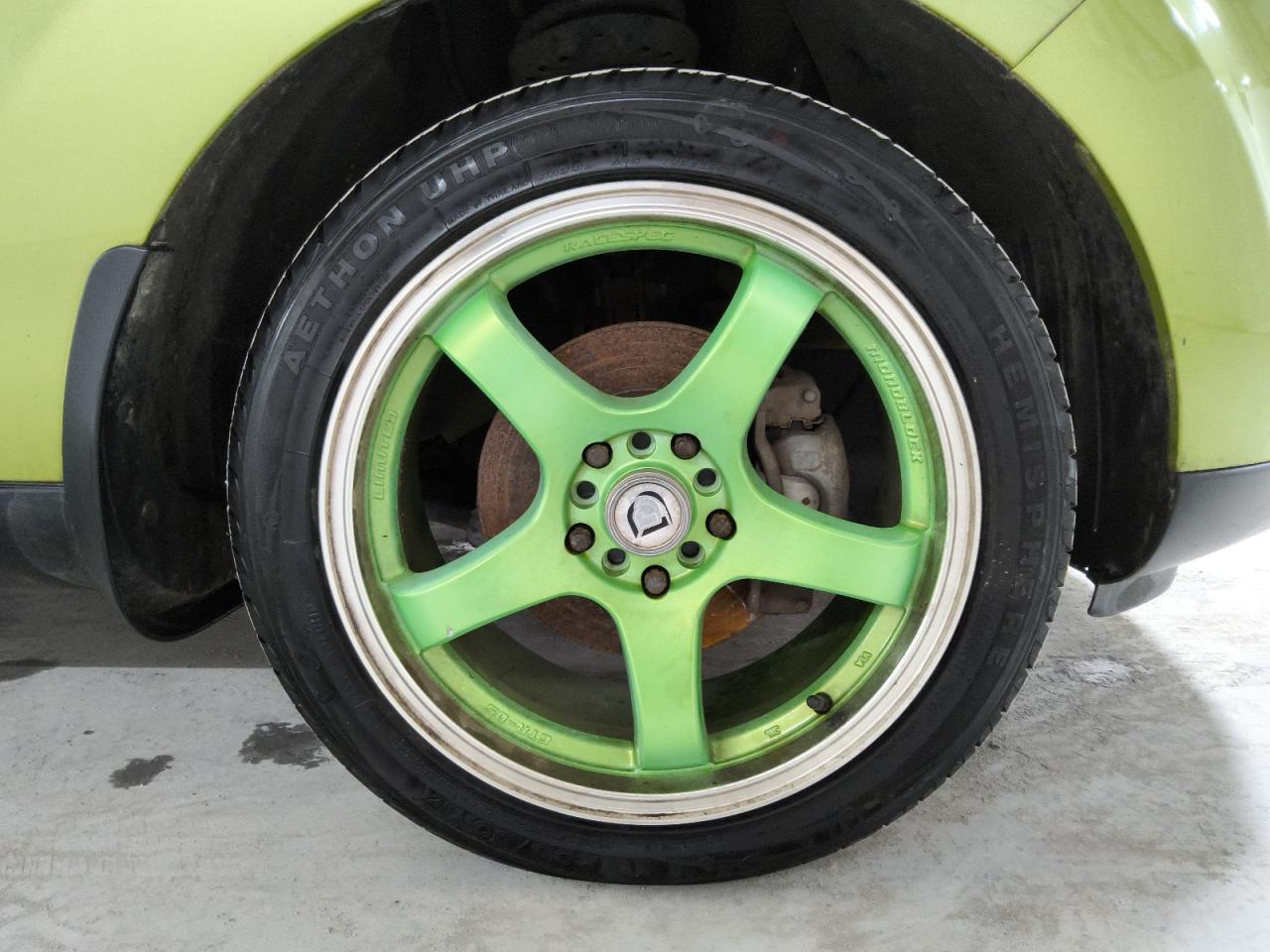 2015 Kia Soul Base Green vin: KNDJN2A22F7791410 Damage: Right Front Wheel, Aftermarket, Acceptable