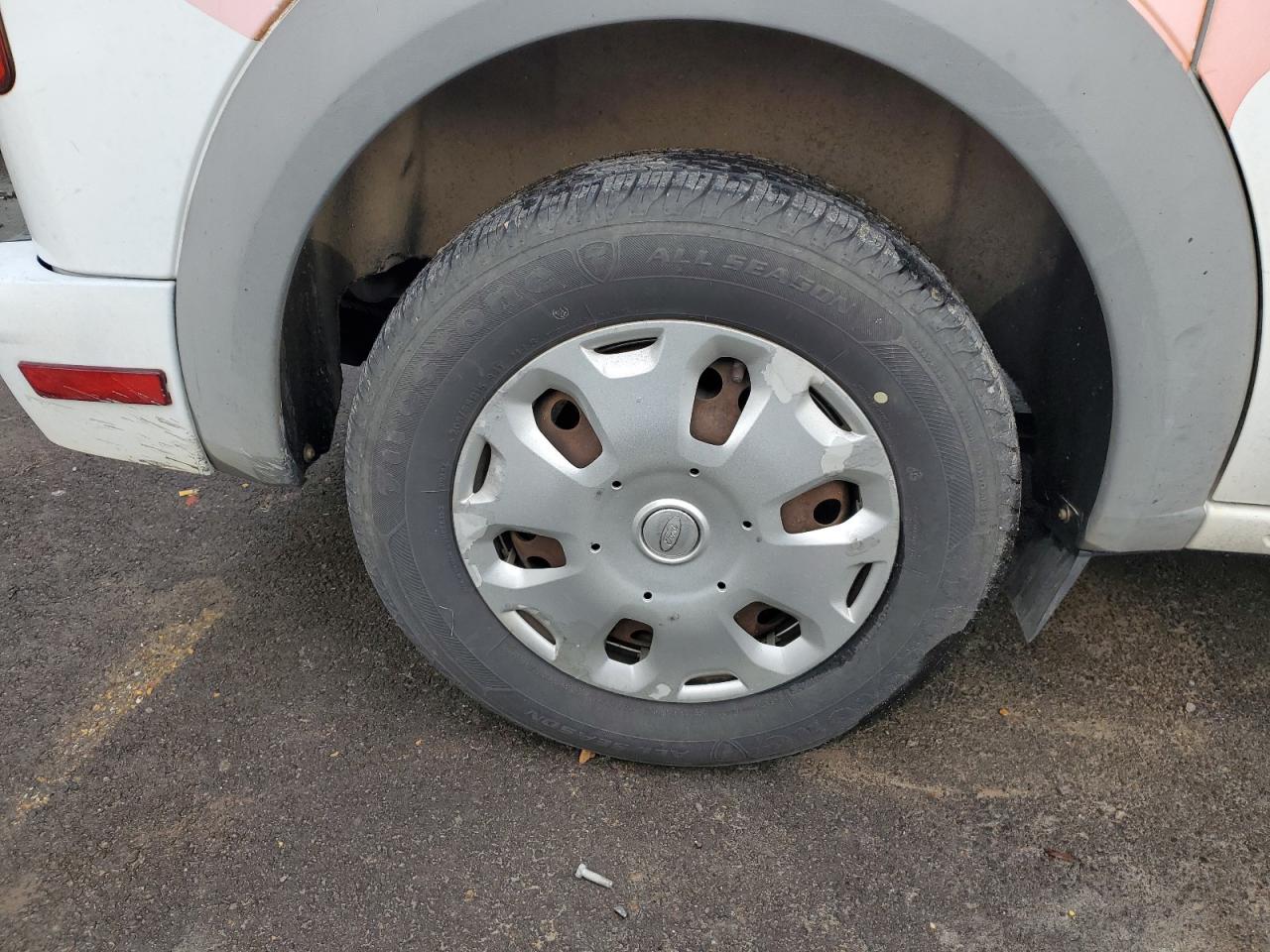2013 Ford Transit Connect White vin: NM0LS7BN7DT136135 Damage: Right Rear Wheel Cover, Peeling, > 12 Inches