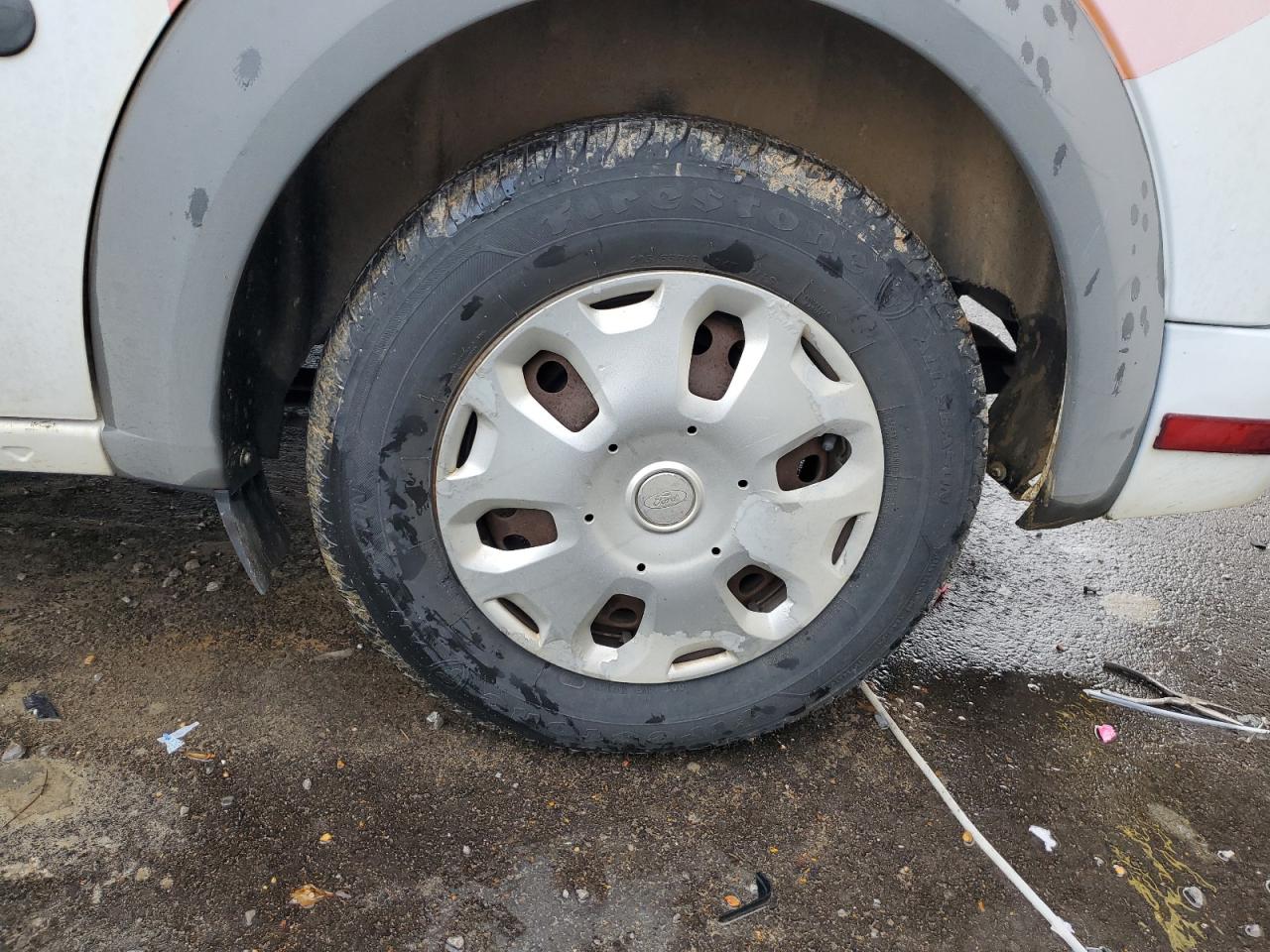 2013 Ford Transit Connect White vin: NM0LS7BN7DT136135 Damage: Left Rear Wheel Cover, Peeling, > 12 Inches