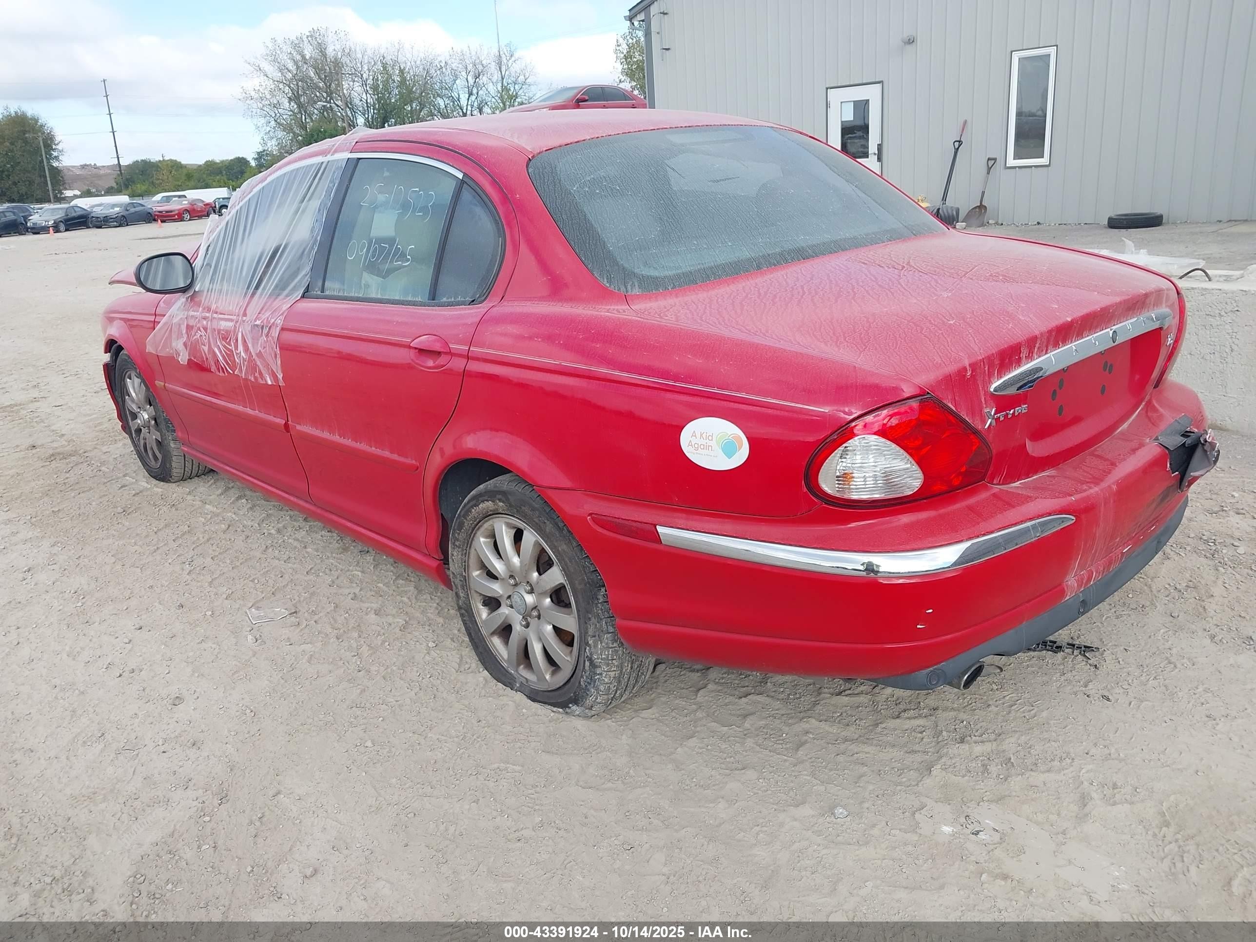 2002 Jaguar X-type 2.5l Red vin: SAJEA51D72XC23717