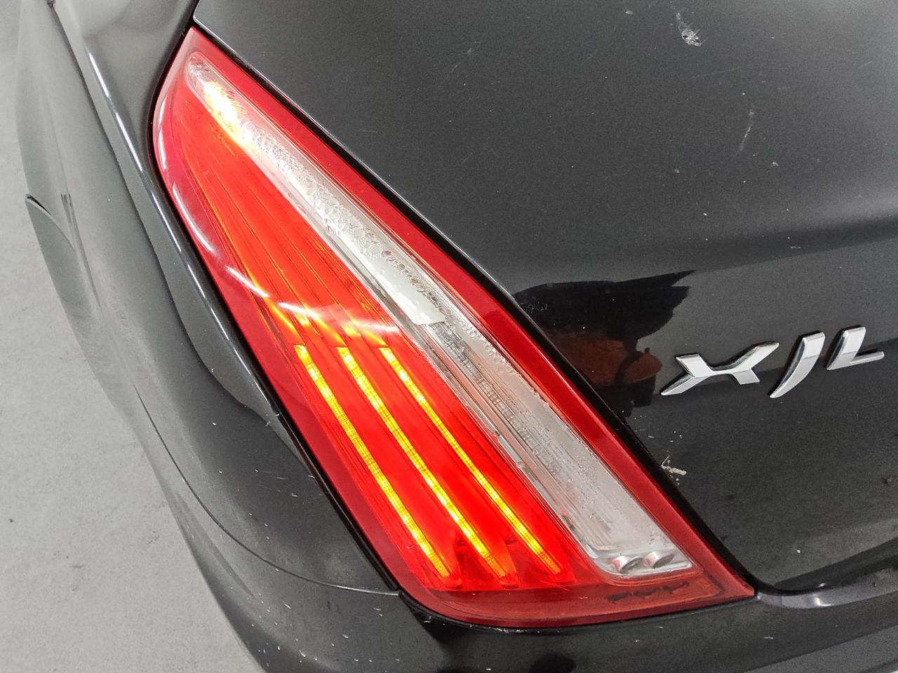 2012 Jaguar Xjl Black vin: SAJWA2GB9CLV28263 Damage: Left Tail Light, Water Damage, Replacement Required