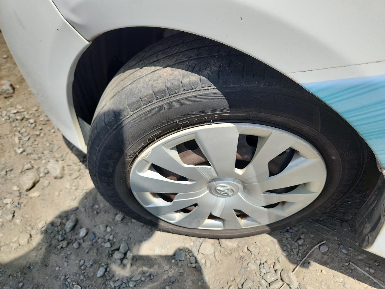 2015 Toyota Yaris 3-door L Two Tone vin: VNKJTUD3XFA021987 Damage: Left Front Fender, Dent(S) W/No Paint Dmg, 2 To 3 Inches