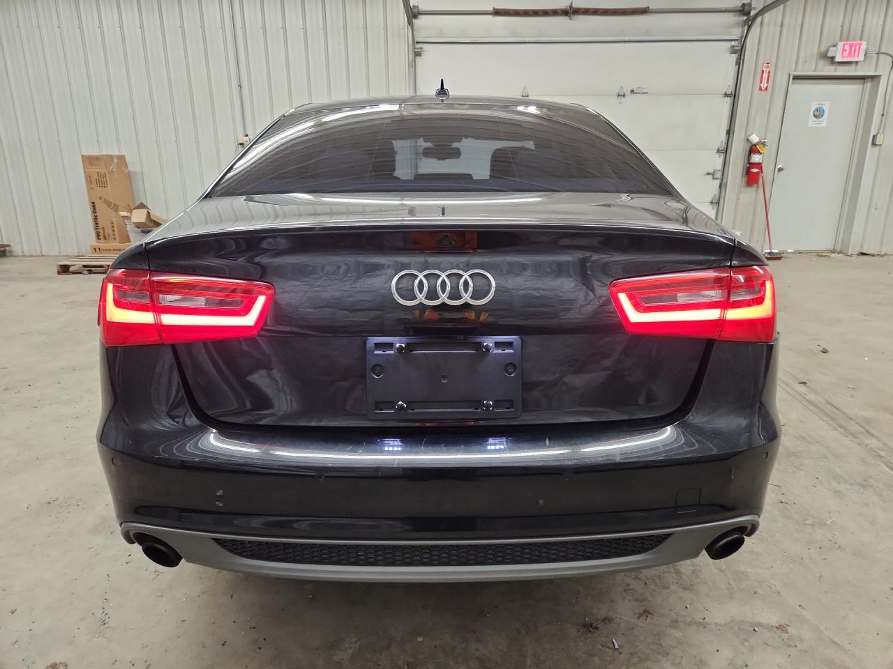 2015 Audi A6 Prestige Black vin: WAUHGAFC3FN020404 Damage: Rear Bumper, Gouged, 1 To 2 Inches