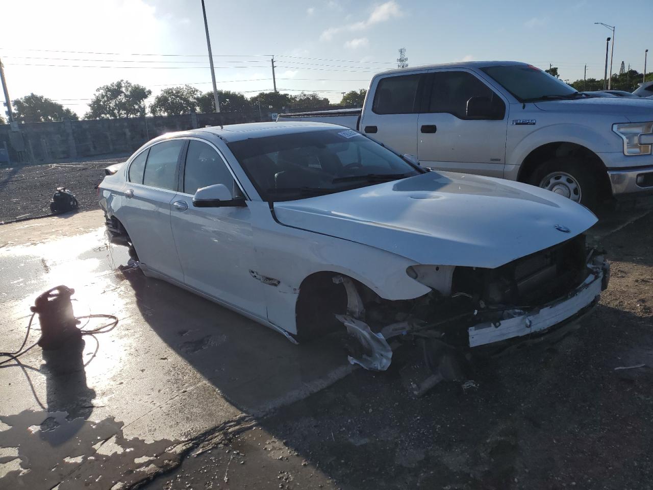 2013 Bmw 750 I White vin: WBAYA8C51DC996867 Damage: Right Front Wheel, Missing, Replacement Required
