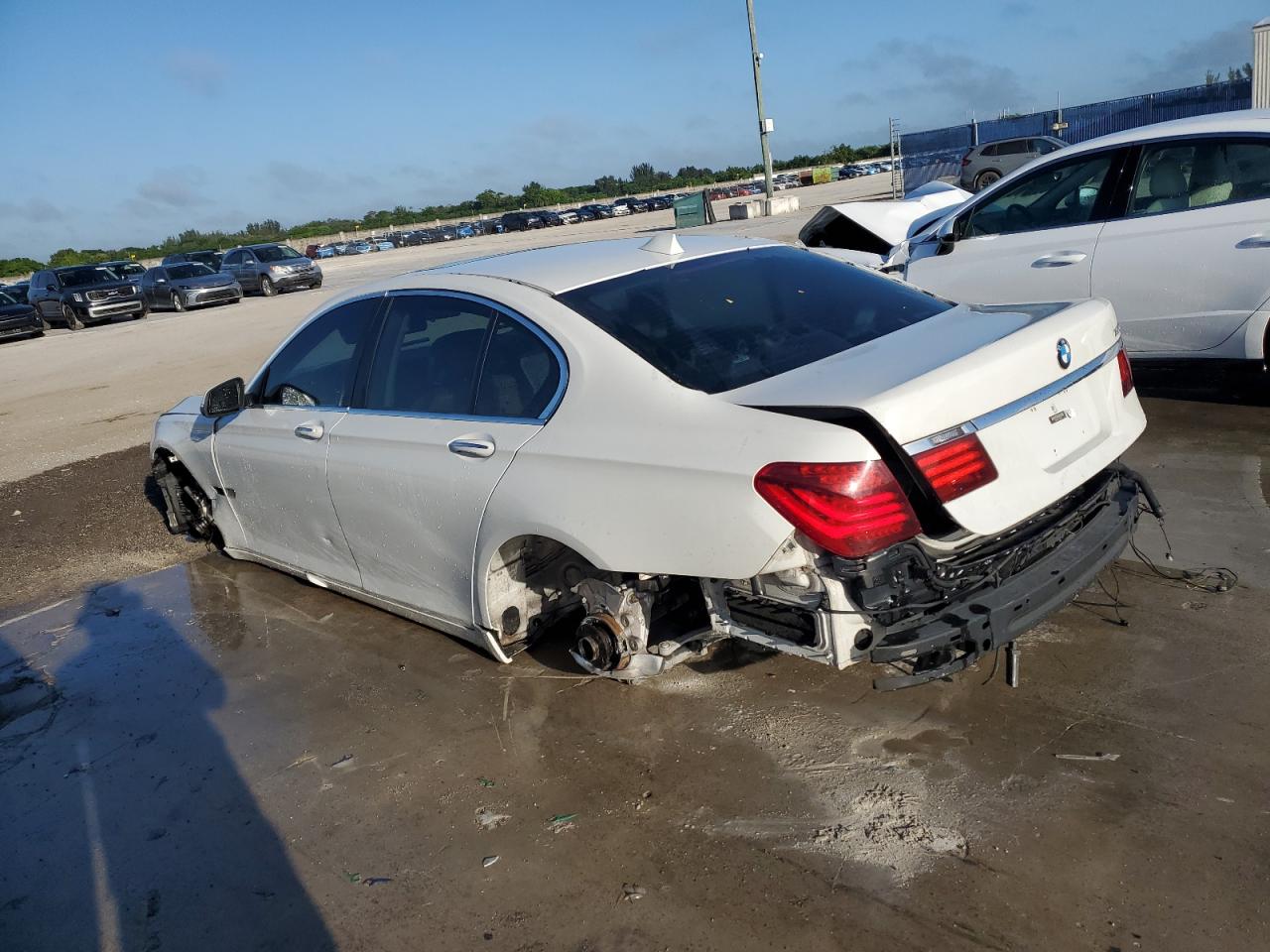 2013 Bmw 750 I White vin: WBAYA8C51DC996867 Damage: Left Rear Wheel, Missing, Replacement Required