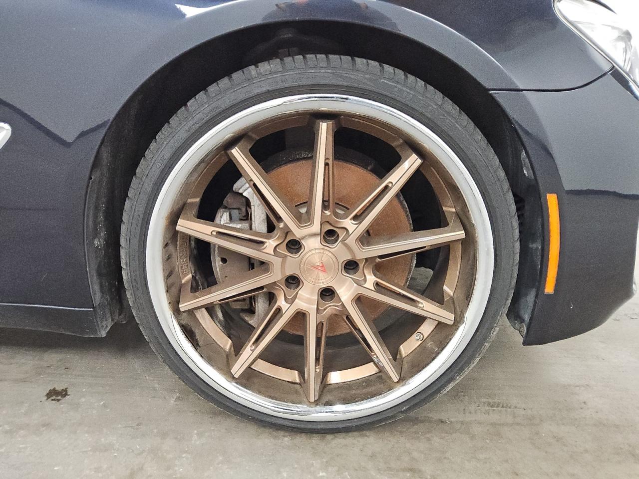 2013 Bmw 750 Xi Black vin: WBAYB6C56DC998261 Damage: Right Front Wheel, Aftermarket, Replacement Required