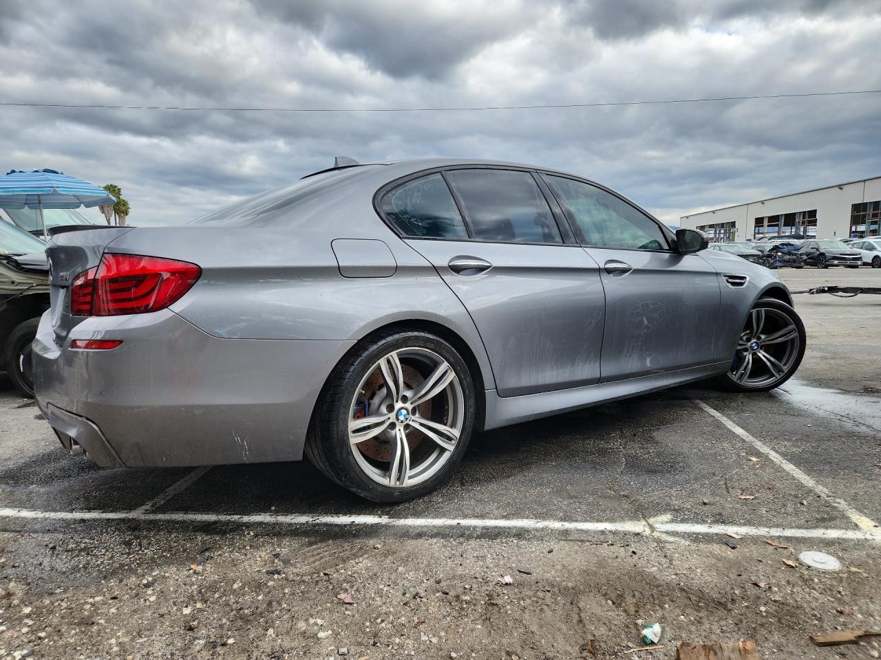 2013 Bmw M5 Gray vin: WBSFV9C52DC773377 Damage: Rear Bumper, Heavy Scratch, 1 To 2 Inches
