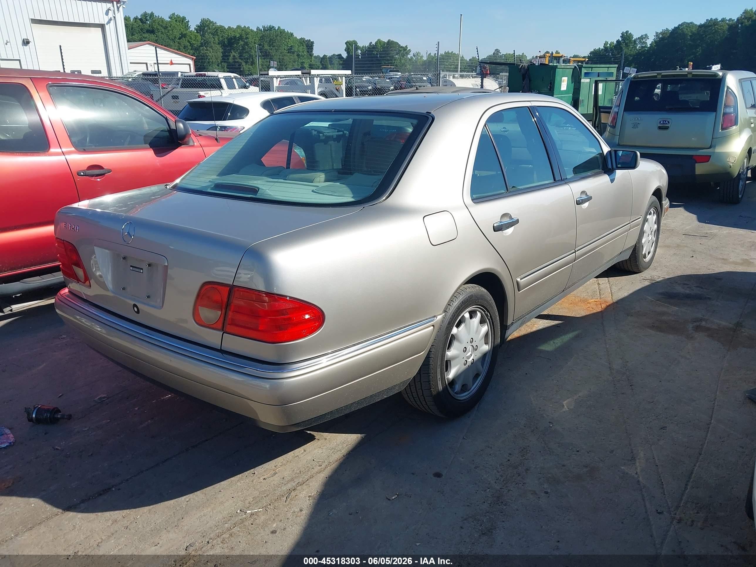 1999 Mercedes-benz E 320   Dark Brown vin: WDBJF65H8XA773001