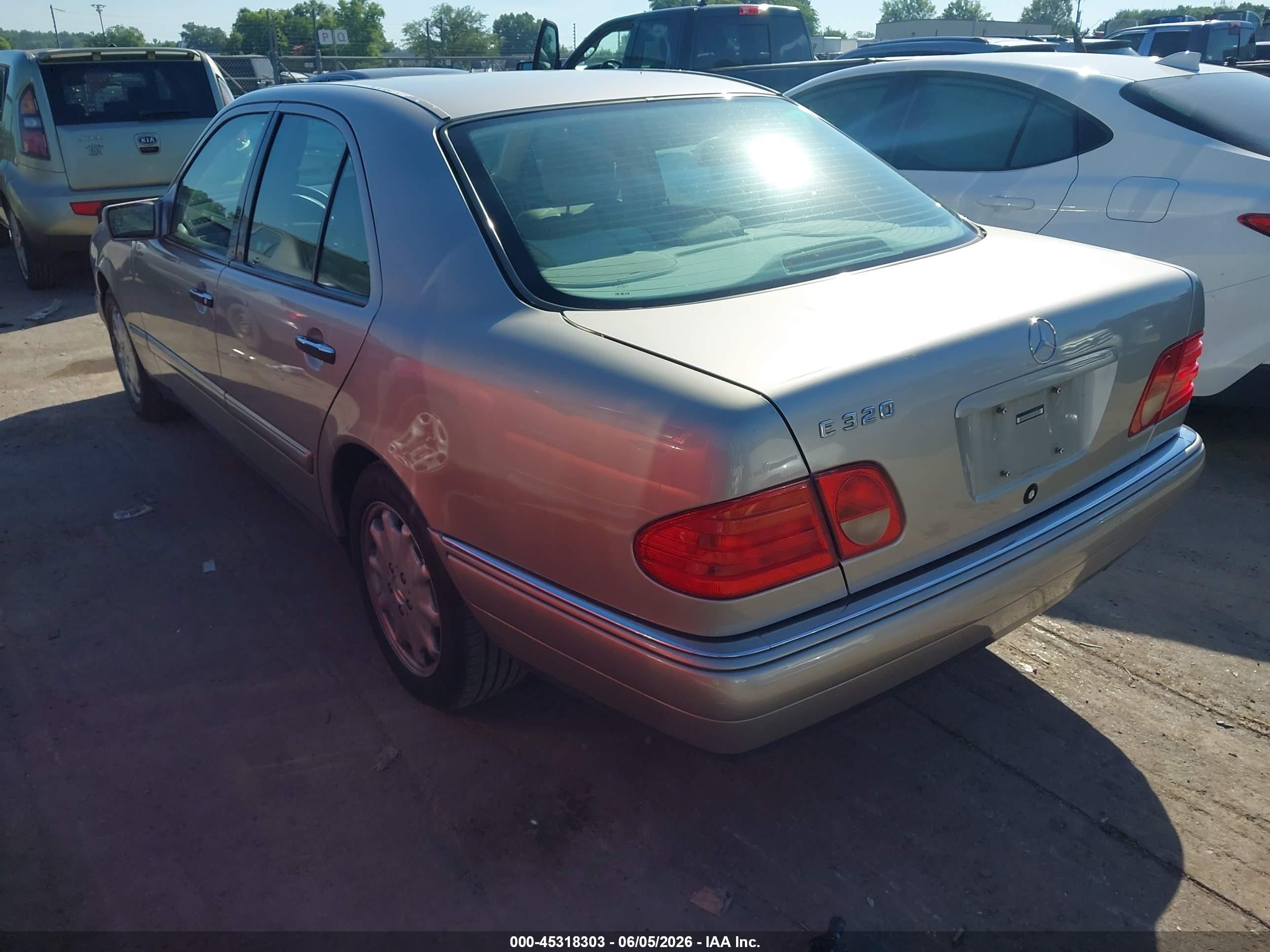 1999 Mercedes-benz E 320   Dark Brown vin: WDBJF65H8XA773001