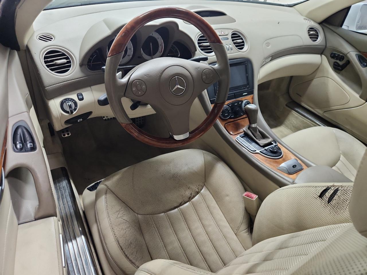 2009 Mercedes-benz Sl 550 White vin: WDBSK71F79F146659 Damage: Left Front Seat Cushion, Torn, > 12 Inches