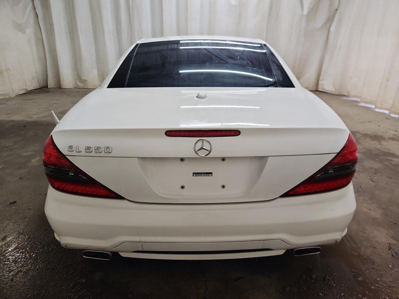 2009 Mercedes-benz Sl 550 White vin: WDBSK71F79F146659 Damage: Rear Bumper, Heavy Scratch, 1/2 To 1 Inch