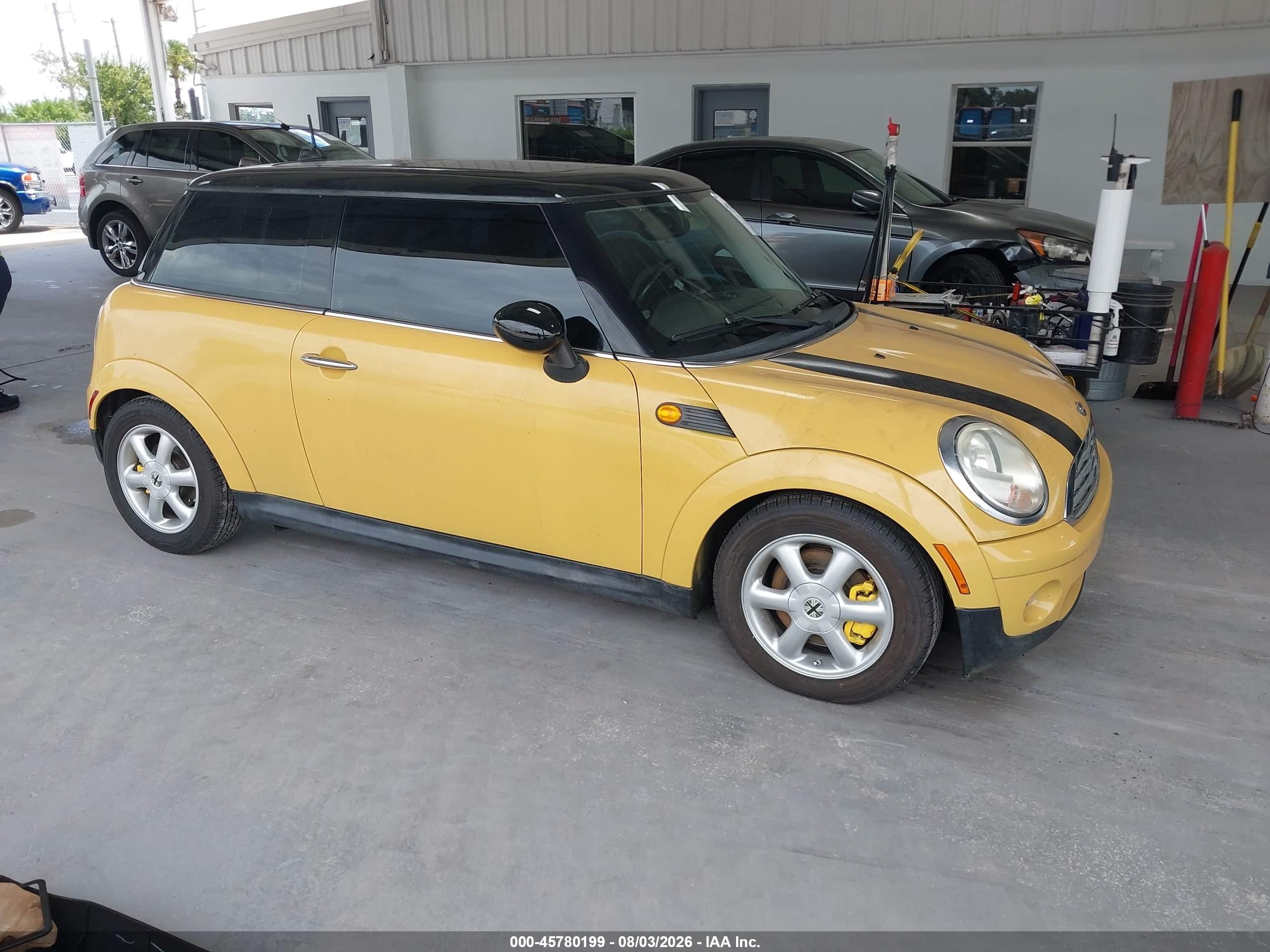 2009 Mini Cooper   Yellow vin: WMWMF33539TW73673