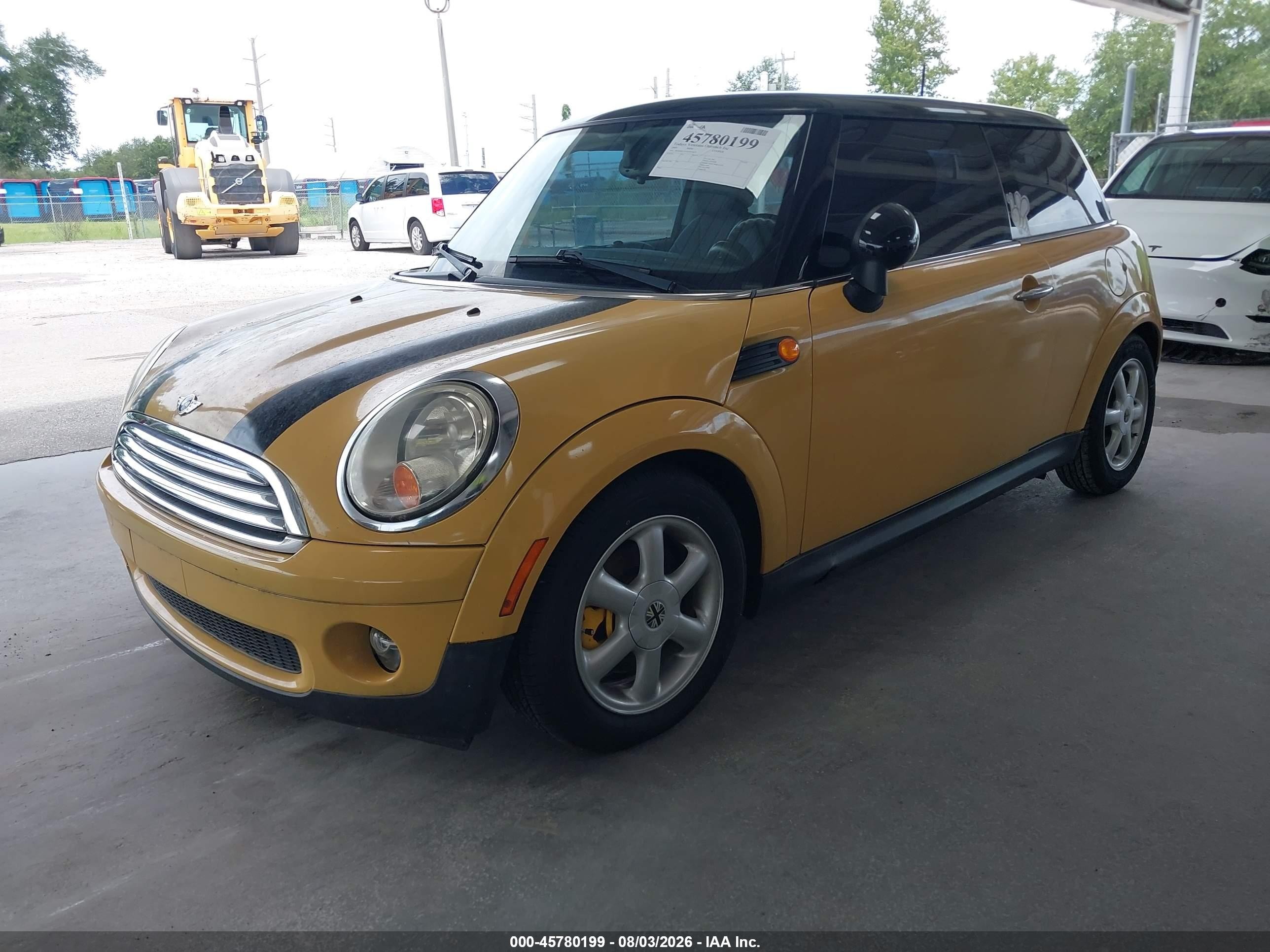 2009 Mini Cooper   Yellow vin: WMWMF33539TW73673