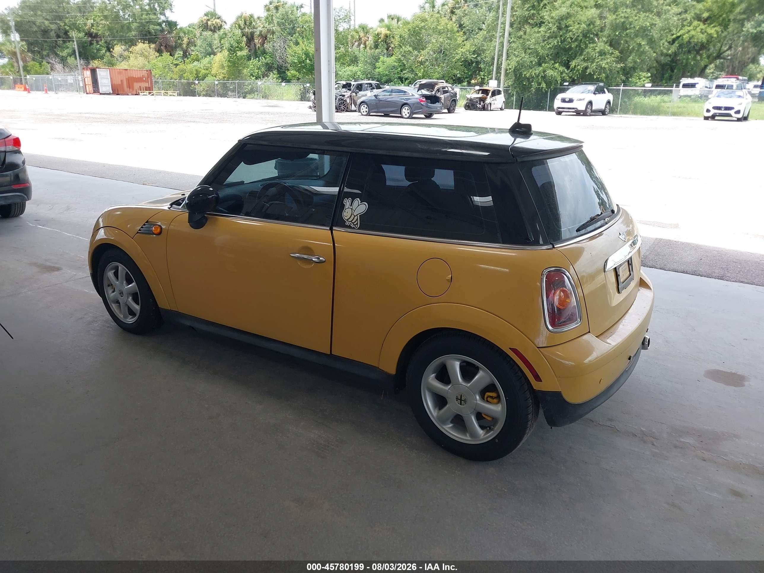 2009 Mini Cooper   Yellow vin: WMWMF33539TW73673
