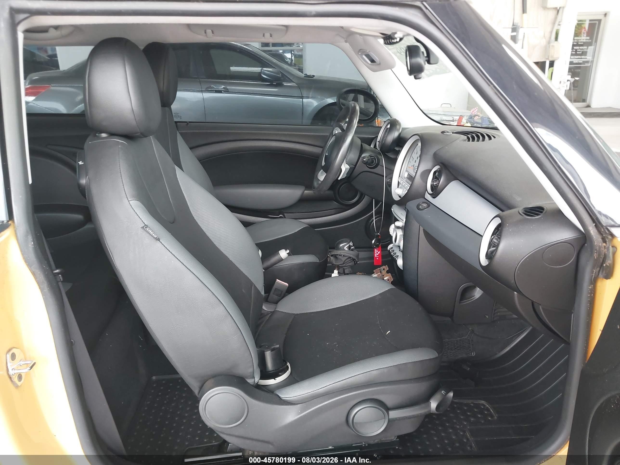 2009 Mini Cooper   Yellow vin: WMWMF33539TW73673