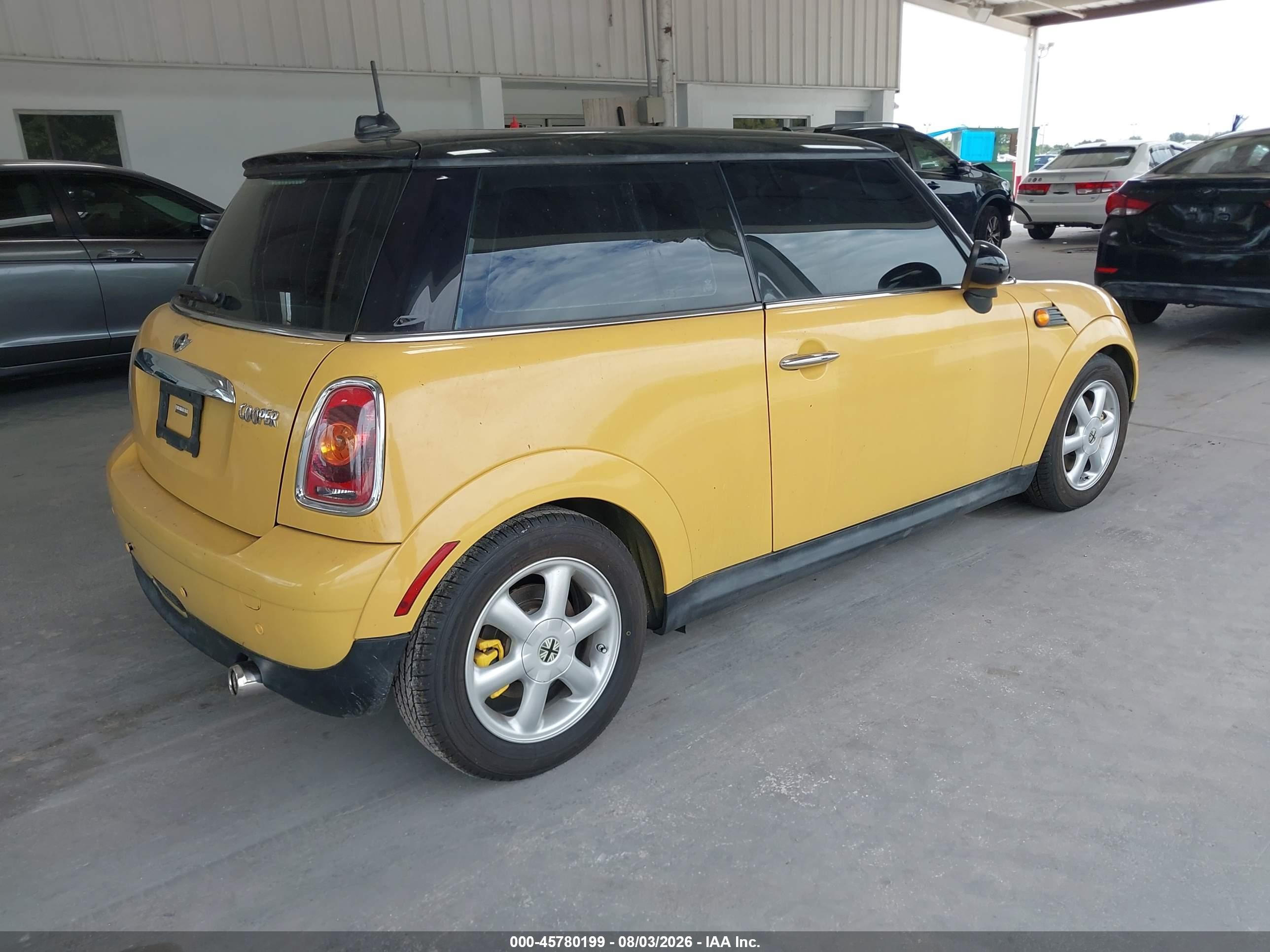 2009 Mini Cooper   Yellow vin: WMWMF33539TW73673