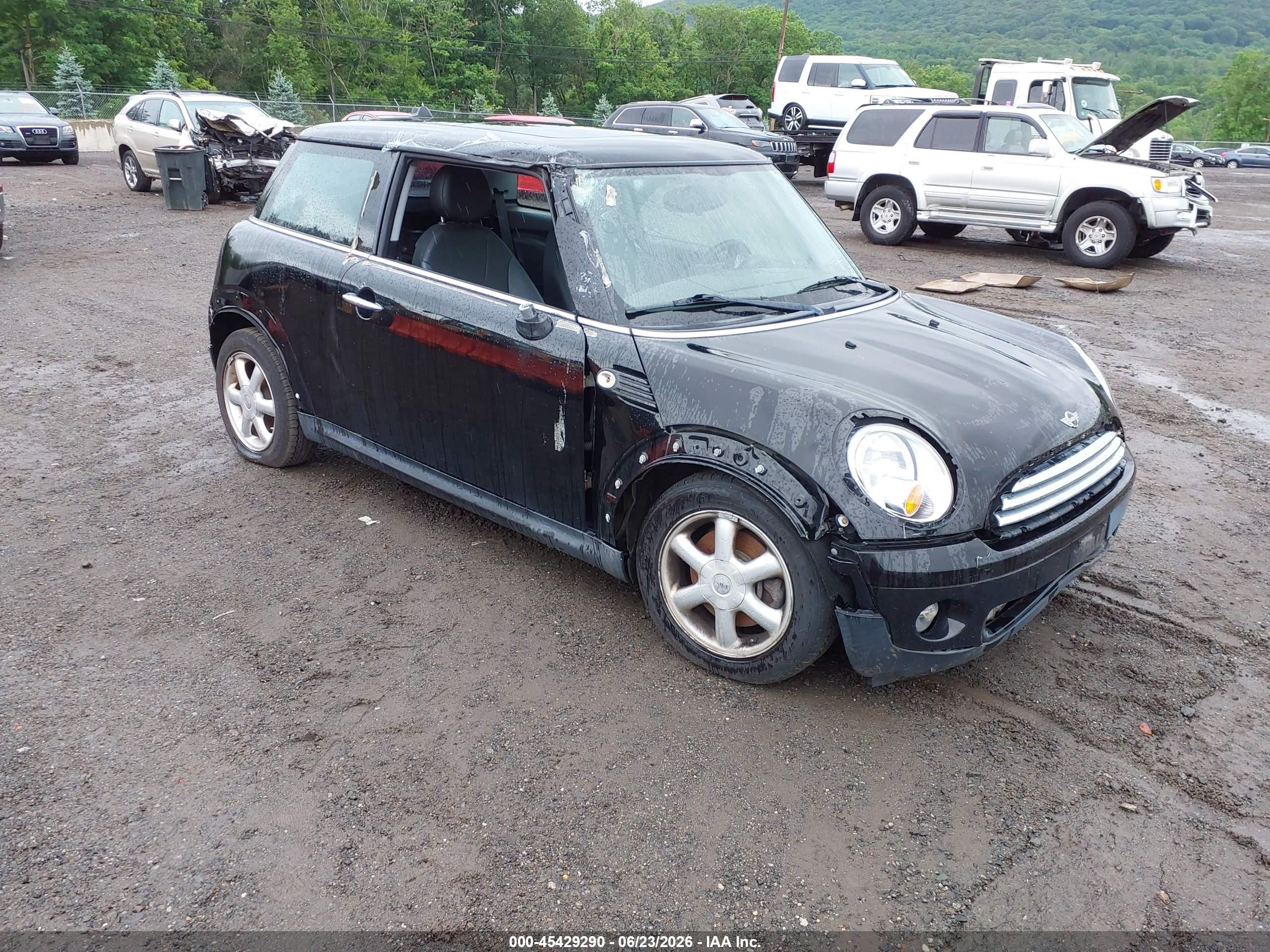 2009 Mini Cooper   Black vin: WMWMF33559TW73979