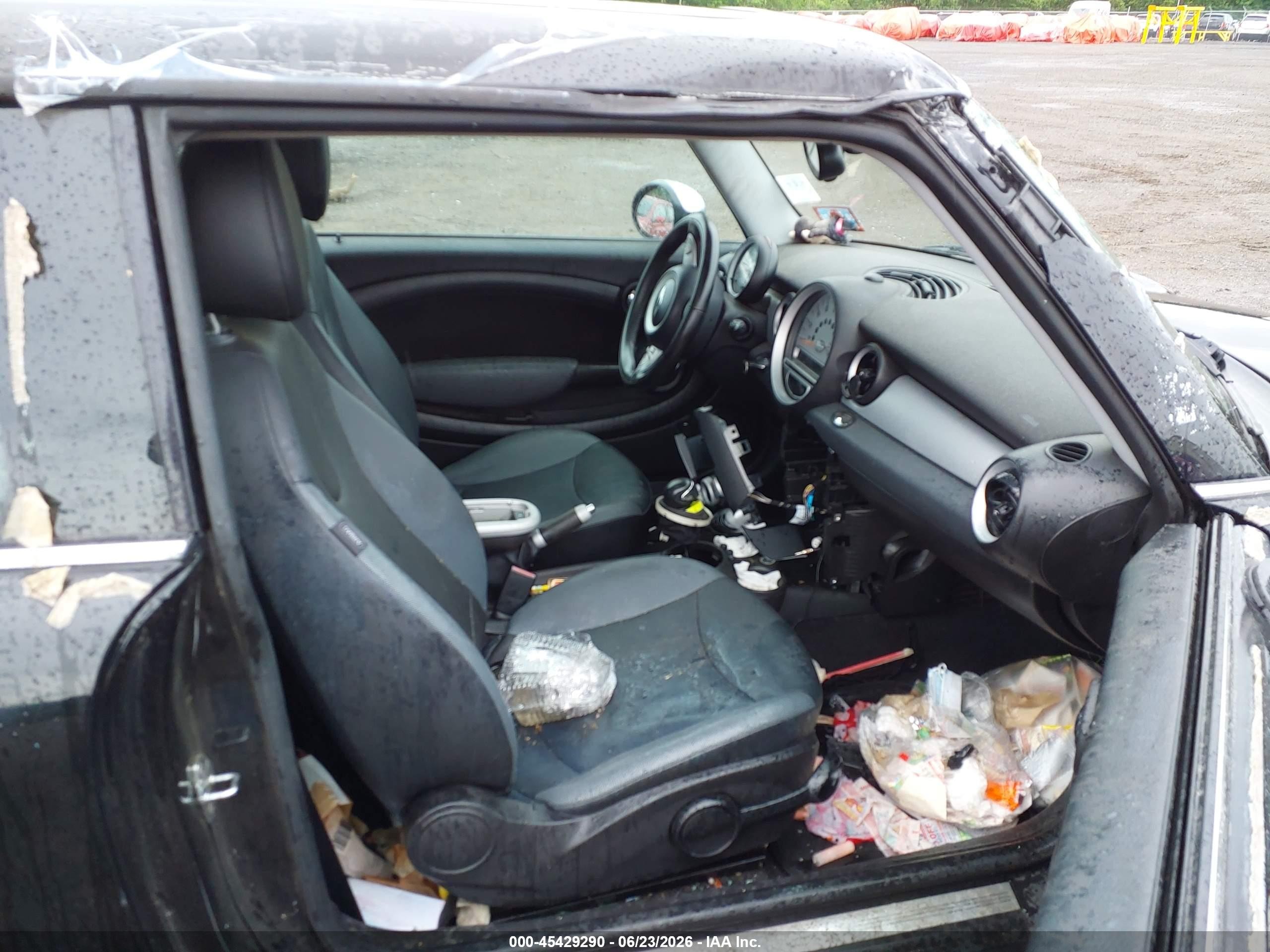 2009 Mini Cooper   Black vin: WMWMF33559TW73979