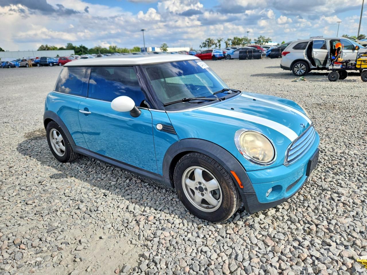 2010 Mini Cooper Turquoise vin: WMWMF3C50ATZ25044