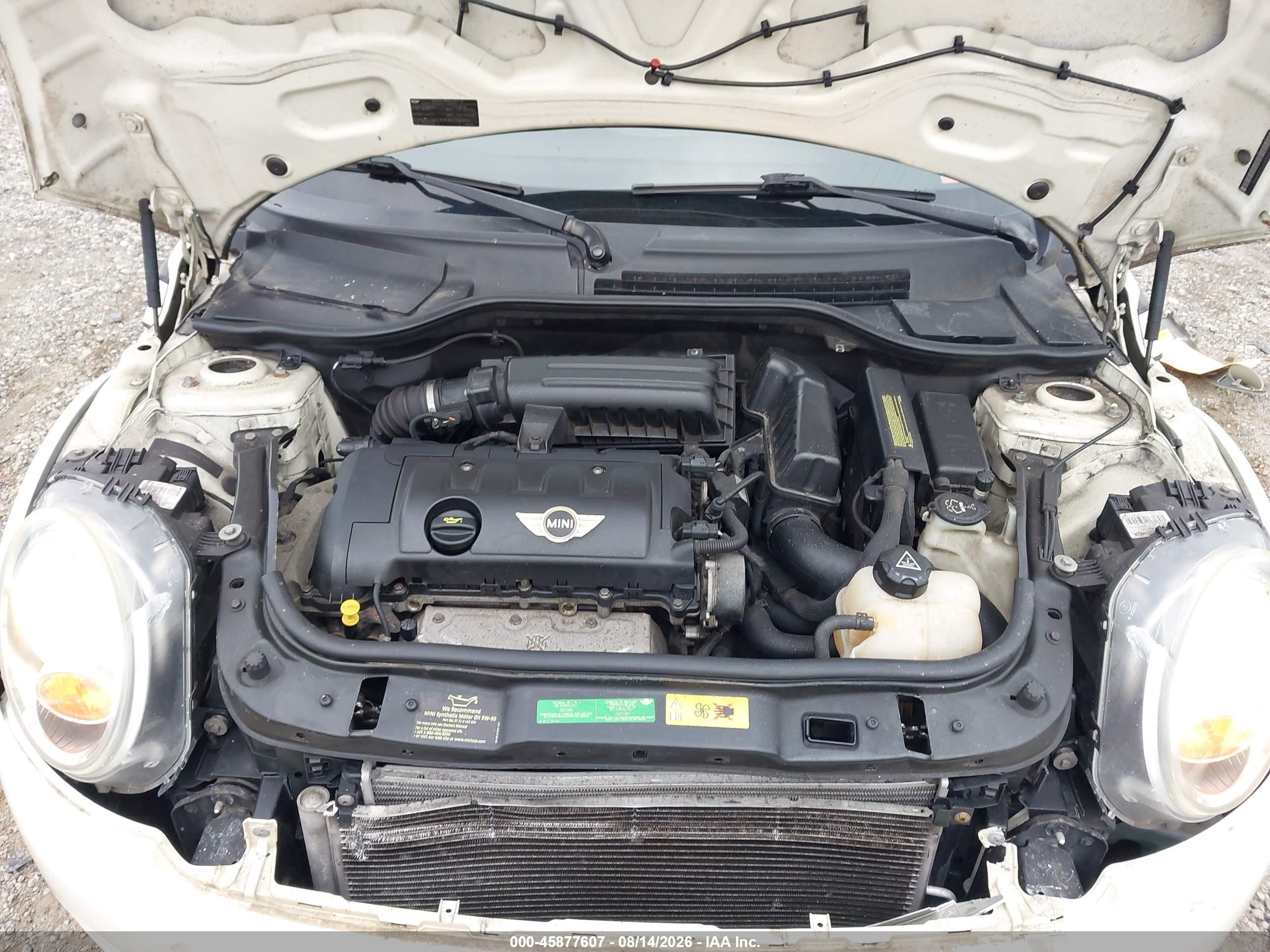 2010 Mini Cooper   Cream vin: WMWMF3C51ATU79504