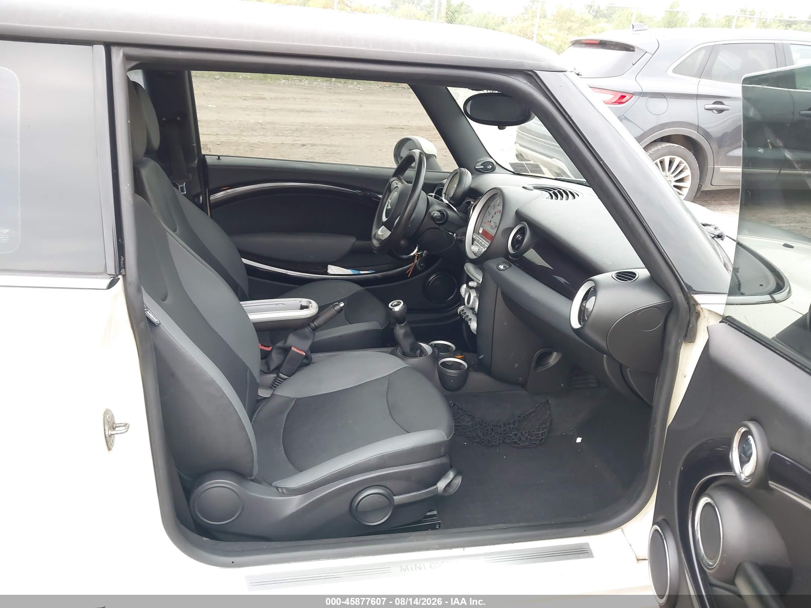 2010 Mini Cooper   Cream vin: WMWMF3C51ATU79504