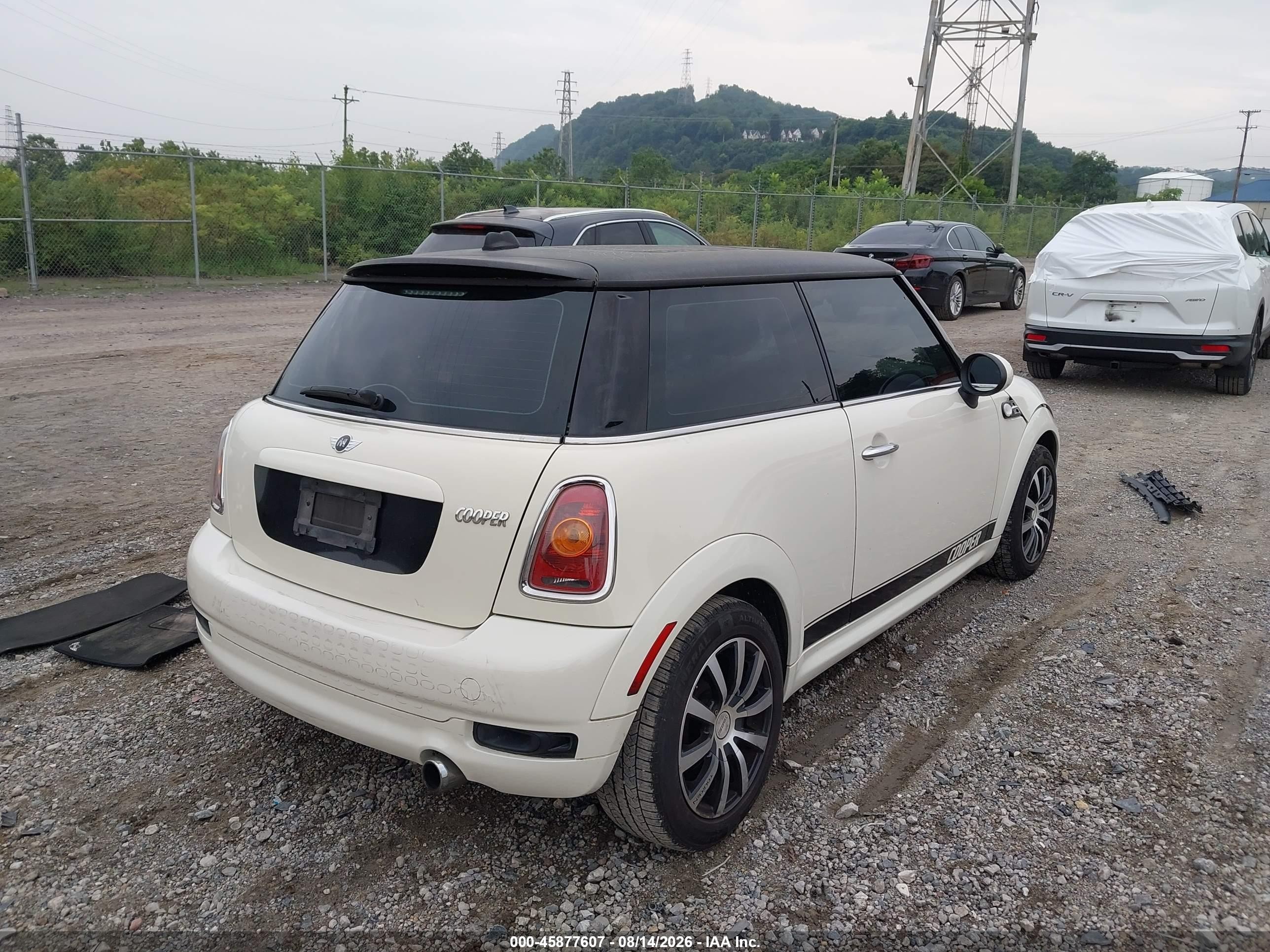 2010 Mini Cooper   Cream vin: WMWMF3C51ATU79504