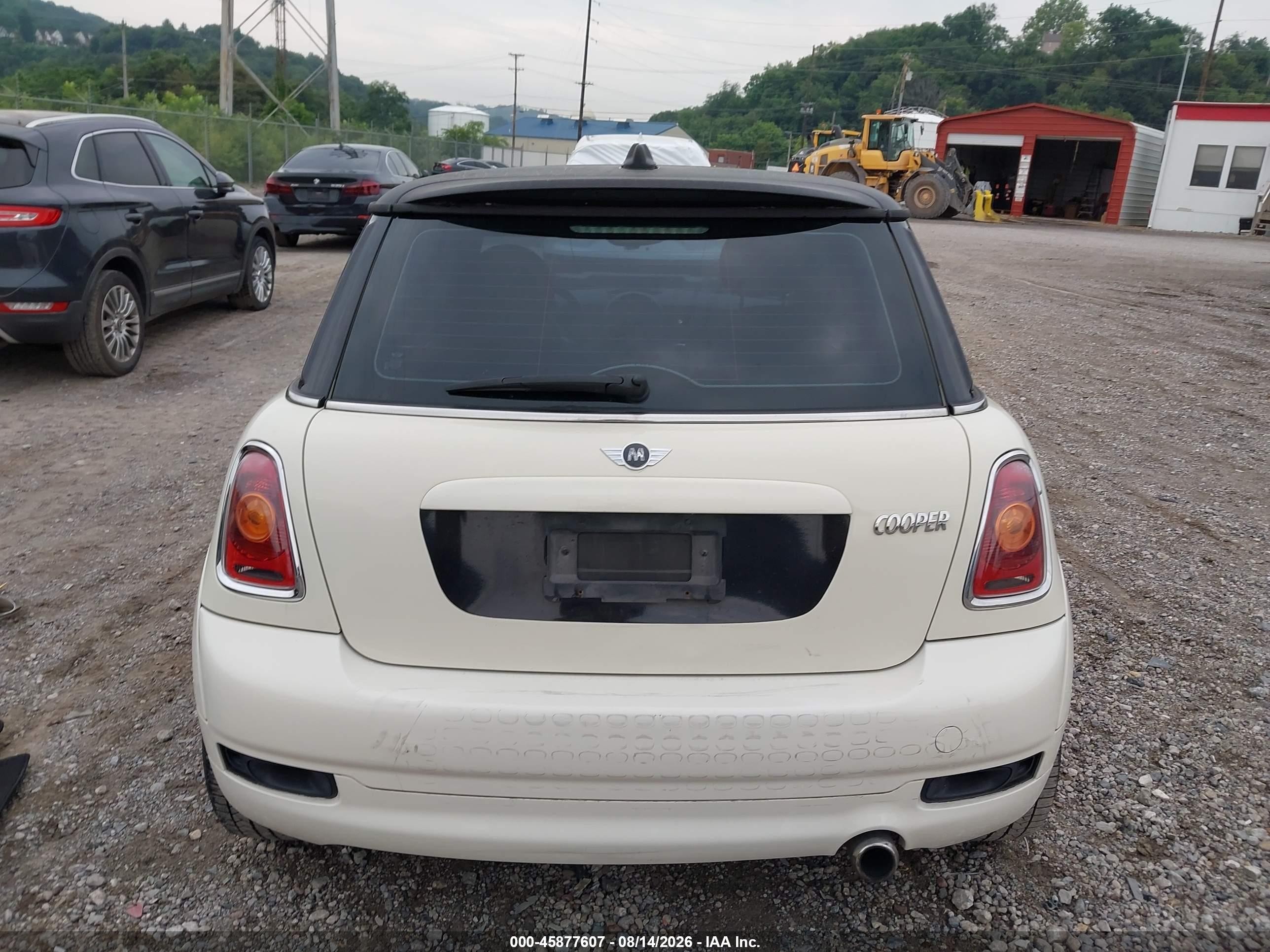 2010 Mini Cooper   Cream vin: WMWMF3C51ATU79504