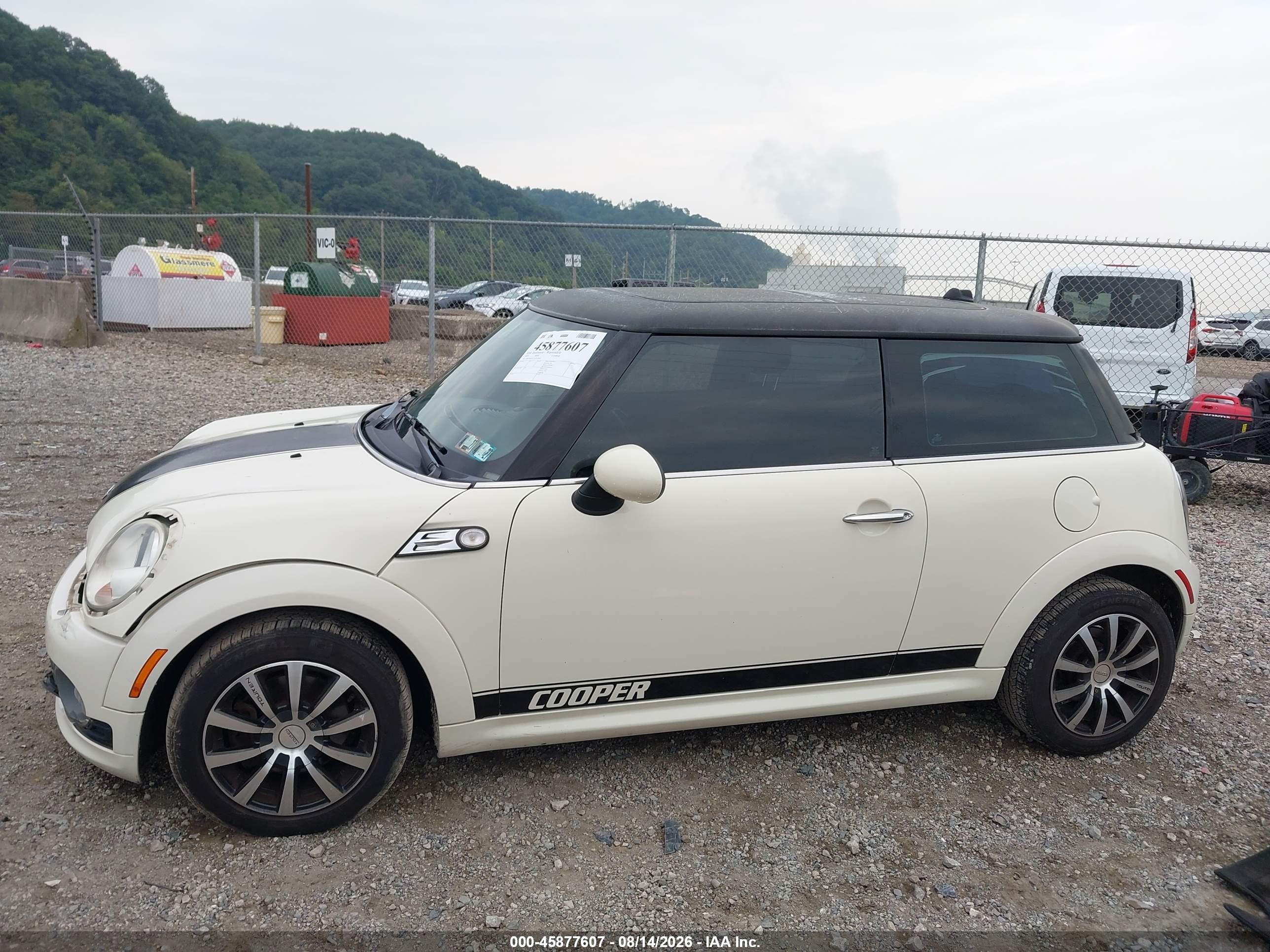 2010 Mini Cooper   Cream vin: WMWMF3C51ATU79504