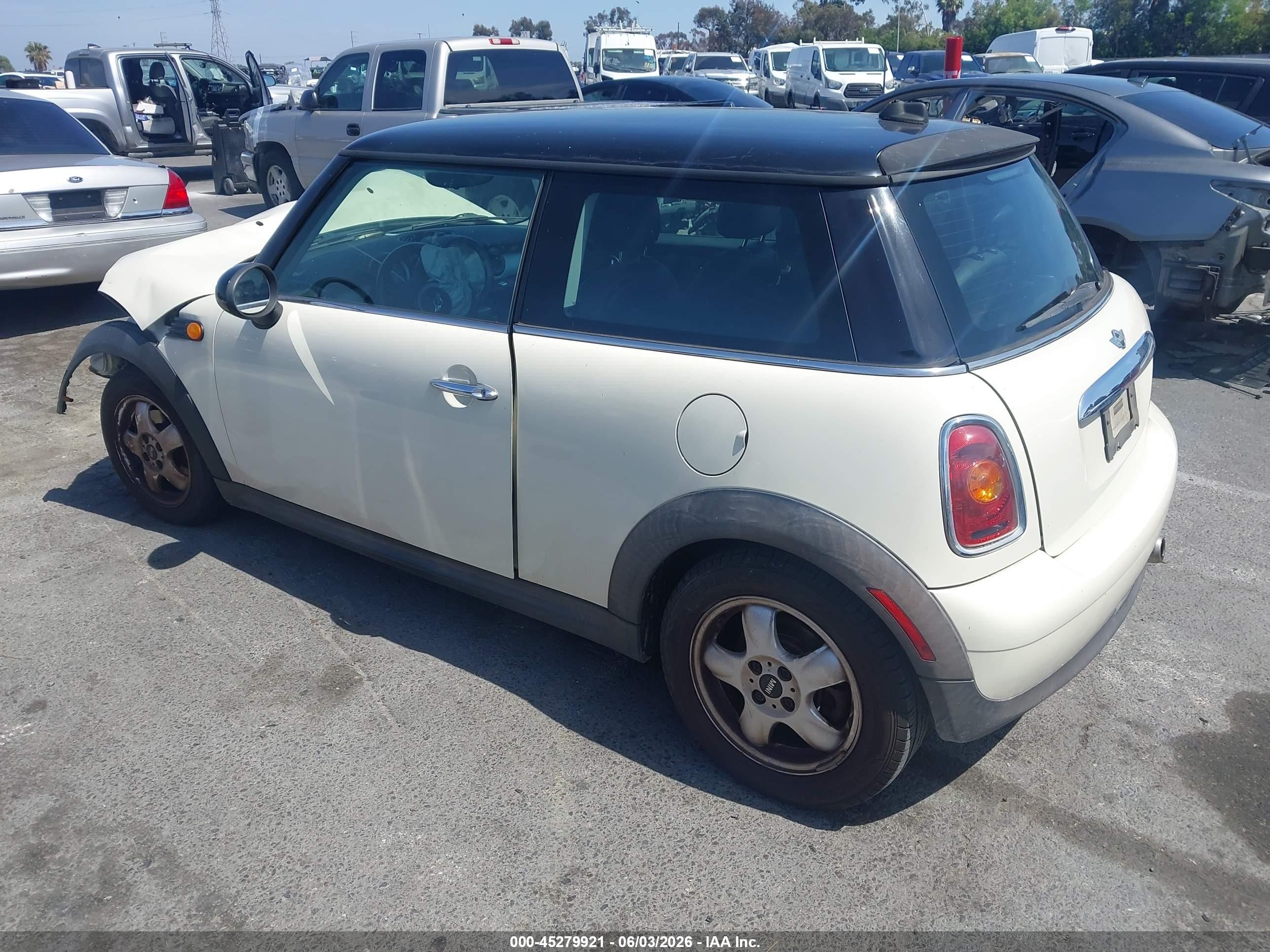2010 Mini Cooper   Cream vin: WMWMF3C54ATZ65644