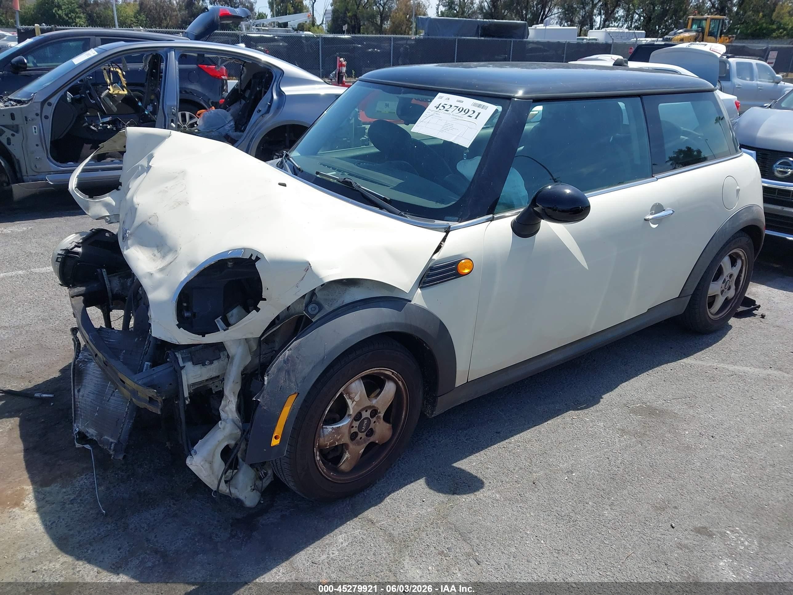 2010 Mini Cooper   Cream vin: WMWMF3C54ATZ65644
