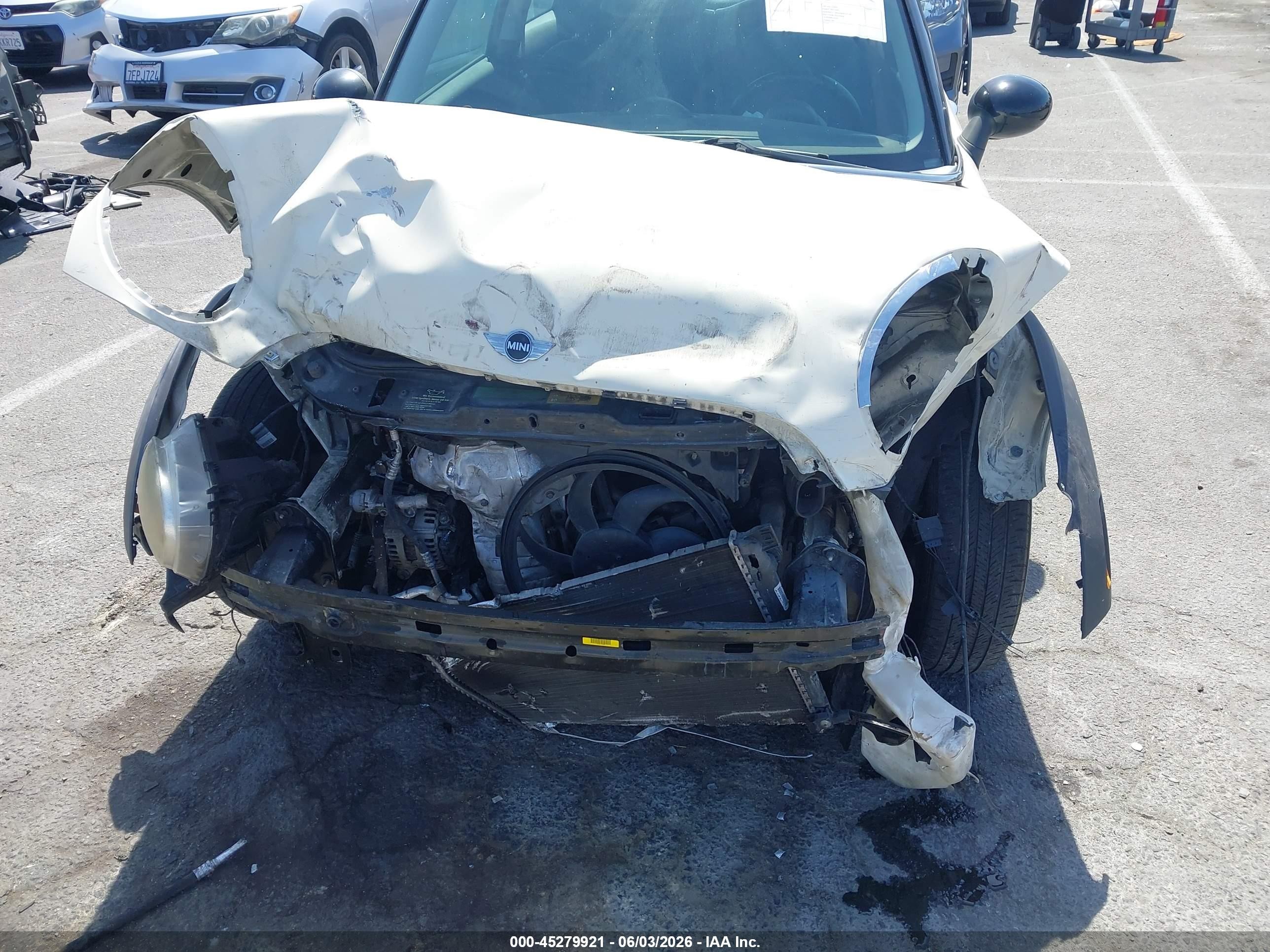 2010 Mini Cooper   Cream vin: WMWMF3C54ATZ65644