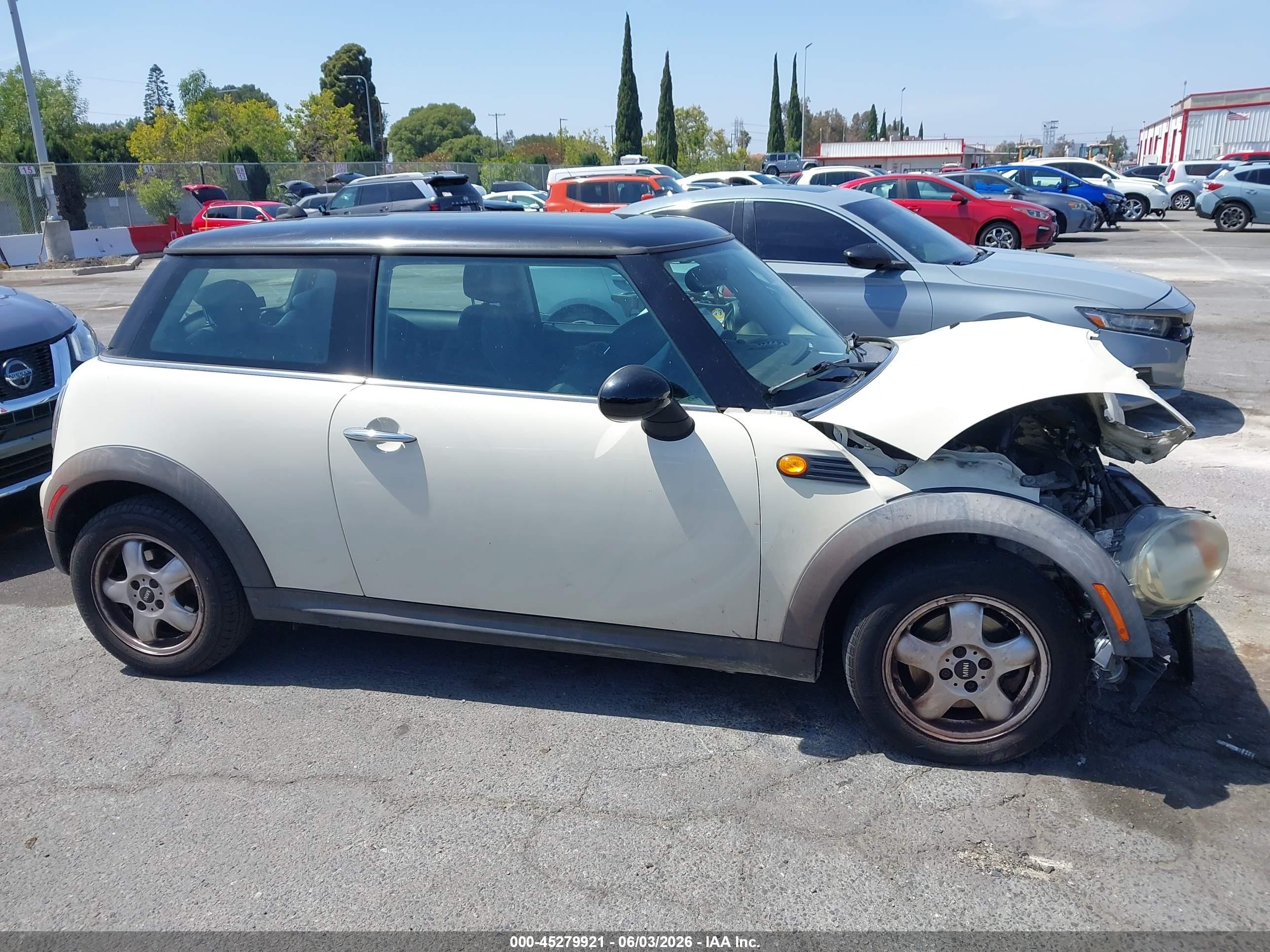 2010 Mini Cooper   Cream vin: WMWMF3C54ATZ65644