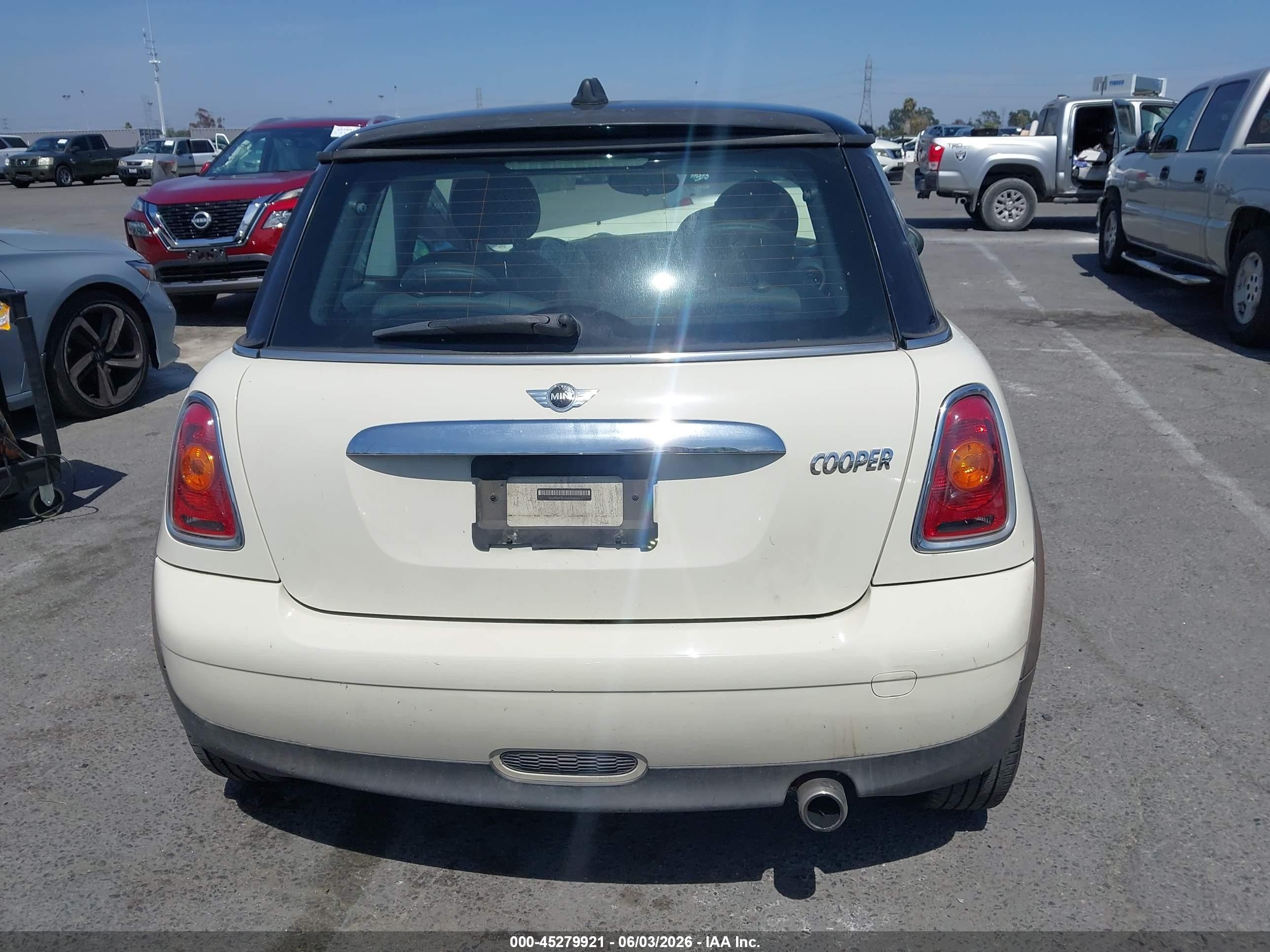 2010 Mini Cooper   Cream vin: WMWMF3C54ATZ65644