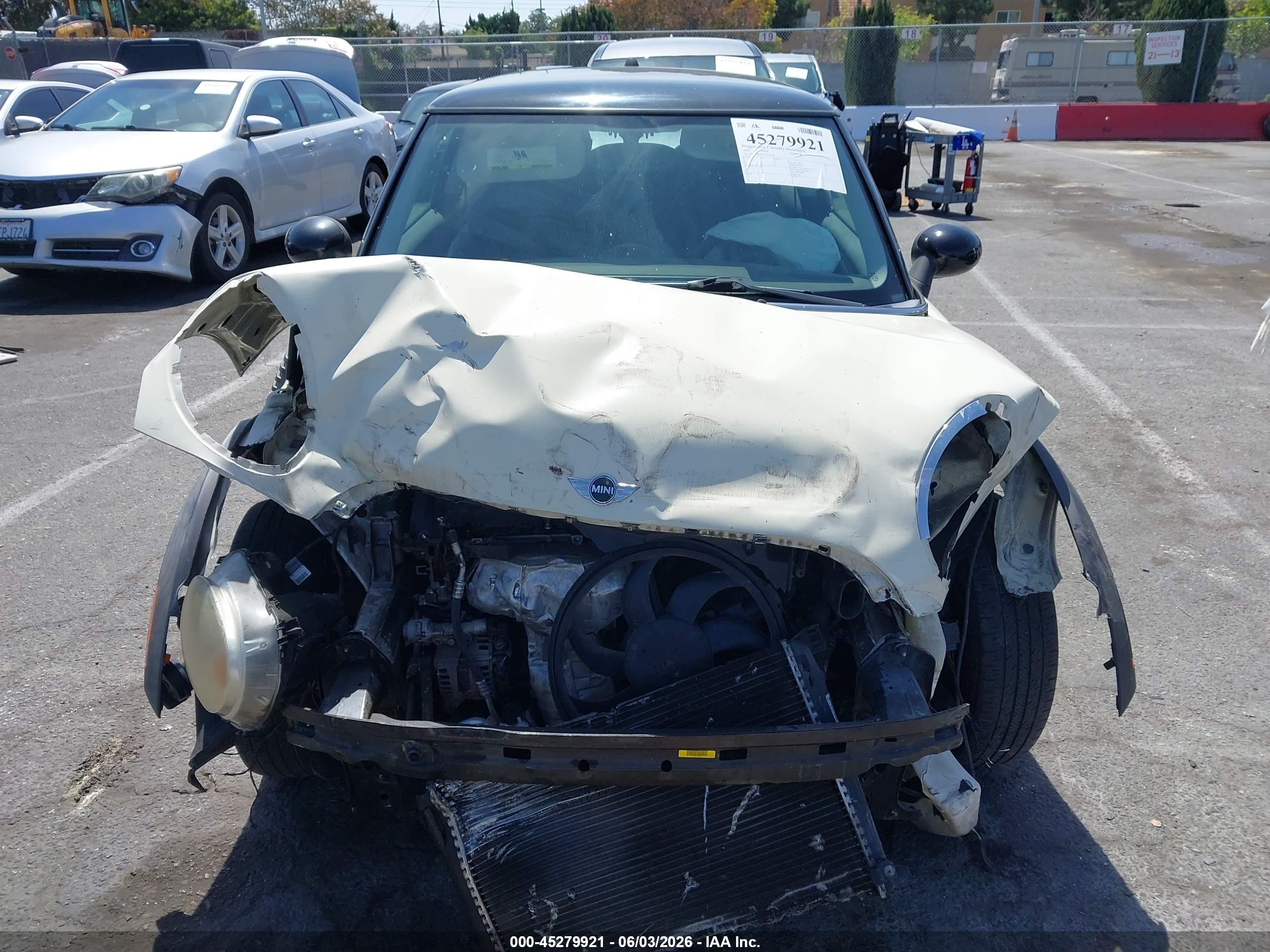 2010 Mini Cooper   Cream vin: WMWMF3C54ATZ65644