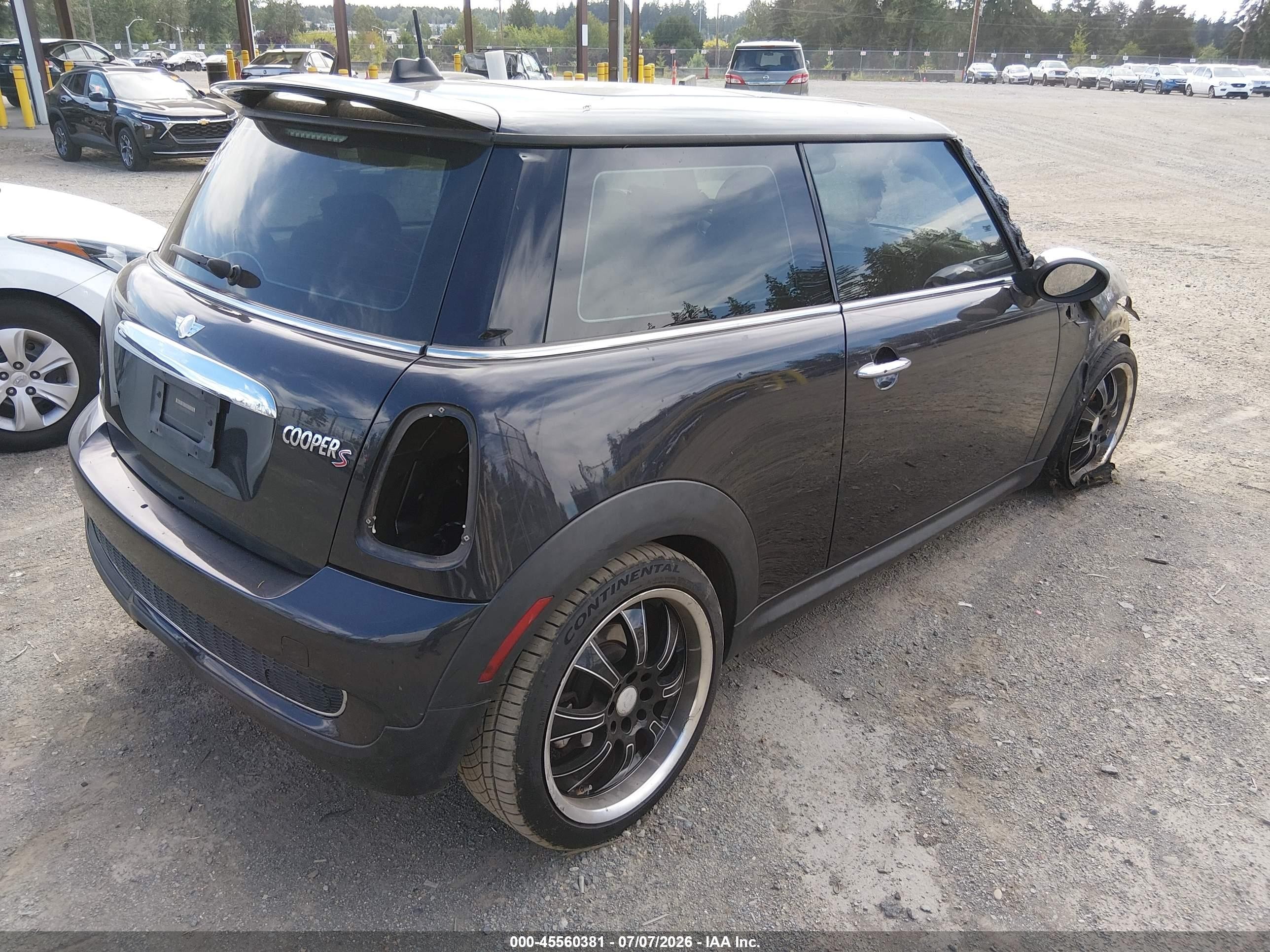 2009 Mini Cooper S   Black vin: WMWMF73509TT95015
